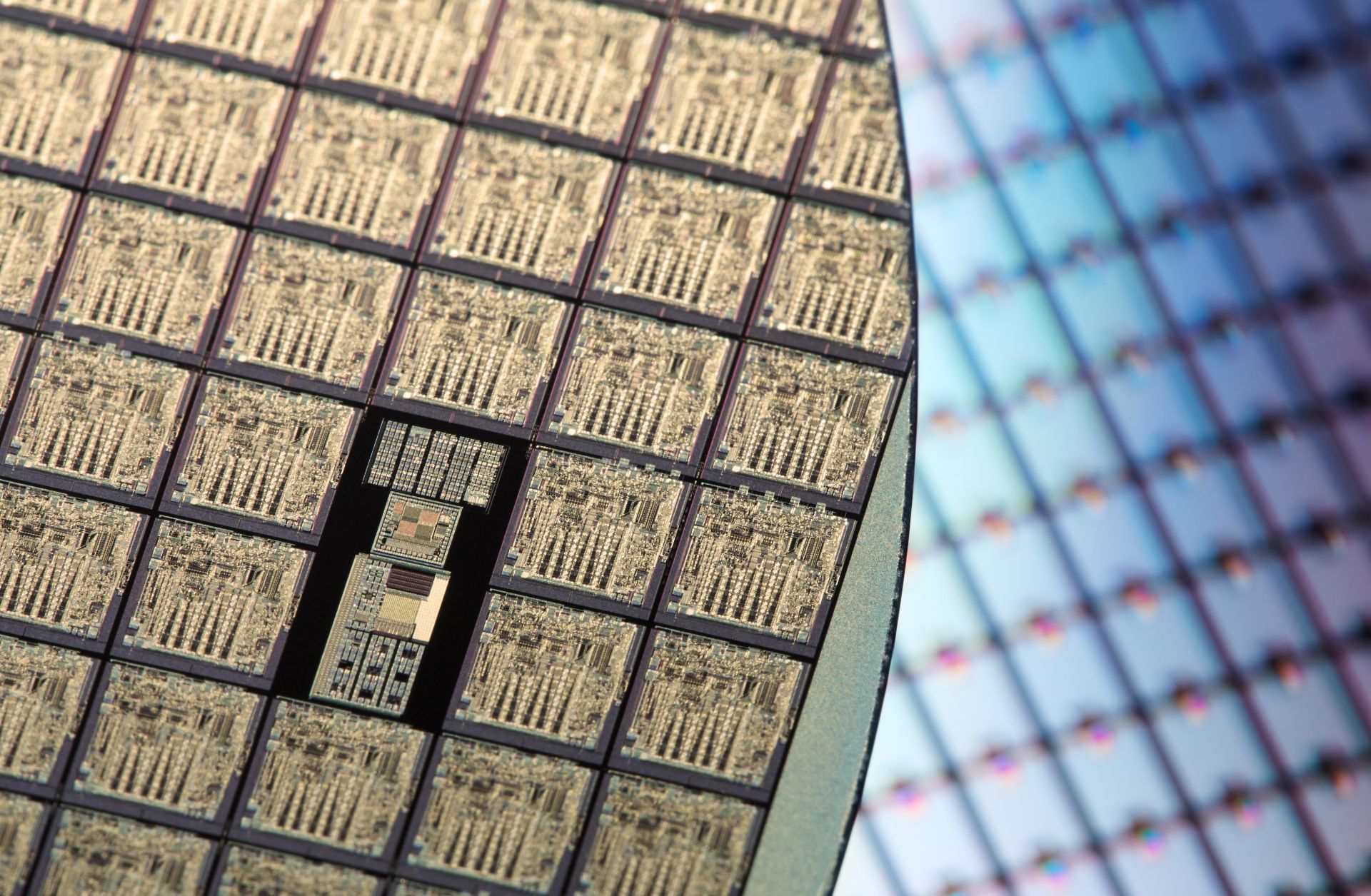 An image displays rows of silicon wafers. An image displays rows of silicon wafers.