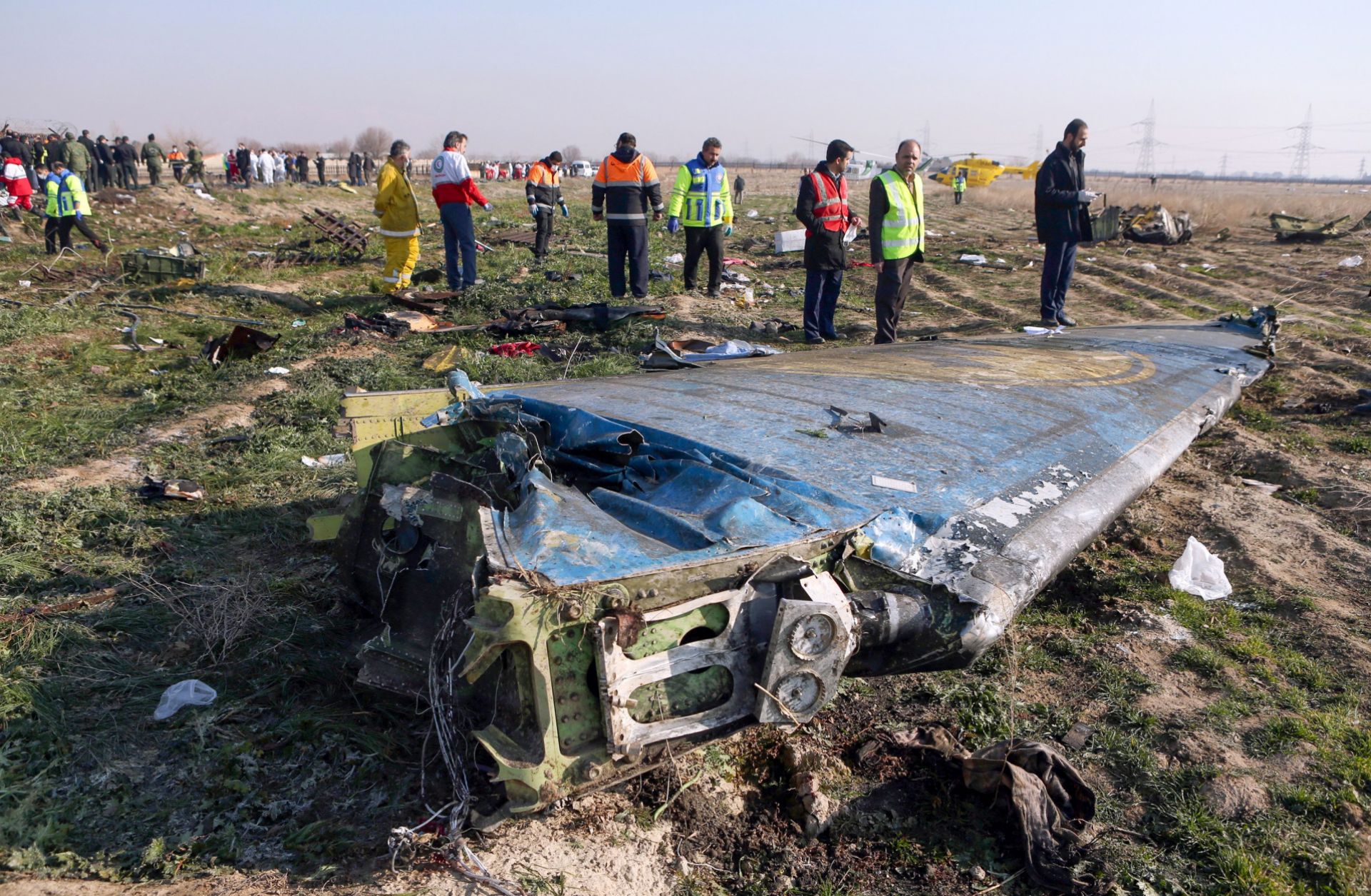 Teams examine the scene of a Ukrainian airliner that crashed being unintentionally targeted by Iranian air defenses shortly after takeoff in Tehran on Jan. 8, 2020. 
