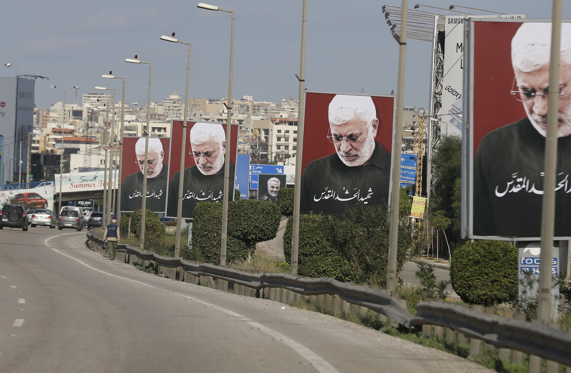 A picture taken on Jan. 11, 2020, shows portraits of Iraq's slain Popular Mobilization Unit deputy chief Abu Mahdi al-Muhandis, the late founder of Kataib Hezbollah, on the southern exit of the Lebanese capital Beirut.