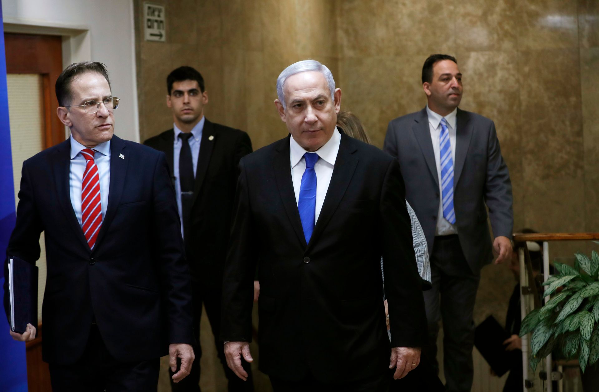 Israeli Prime Minister Benjamin Netanyahu (C) arrives at a weekly Cabinet meeting in Jerusalem on Dec. 8, 2019. 