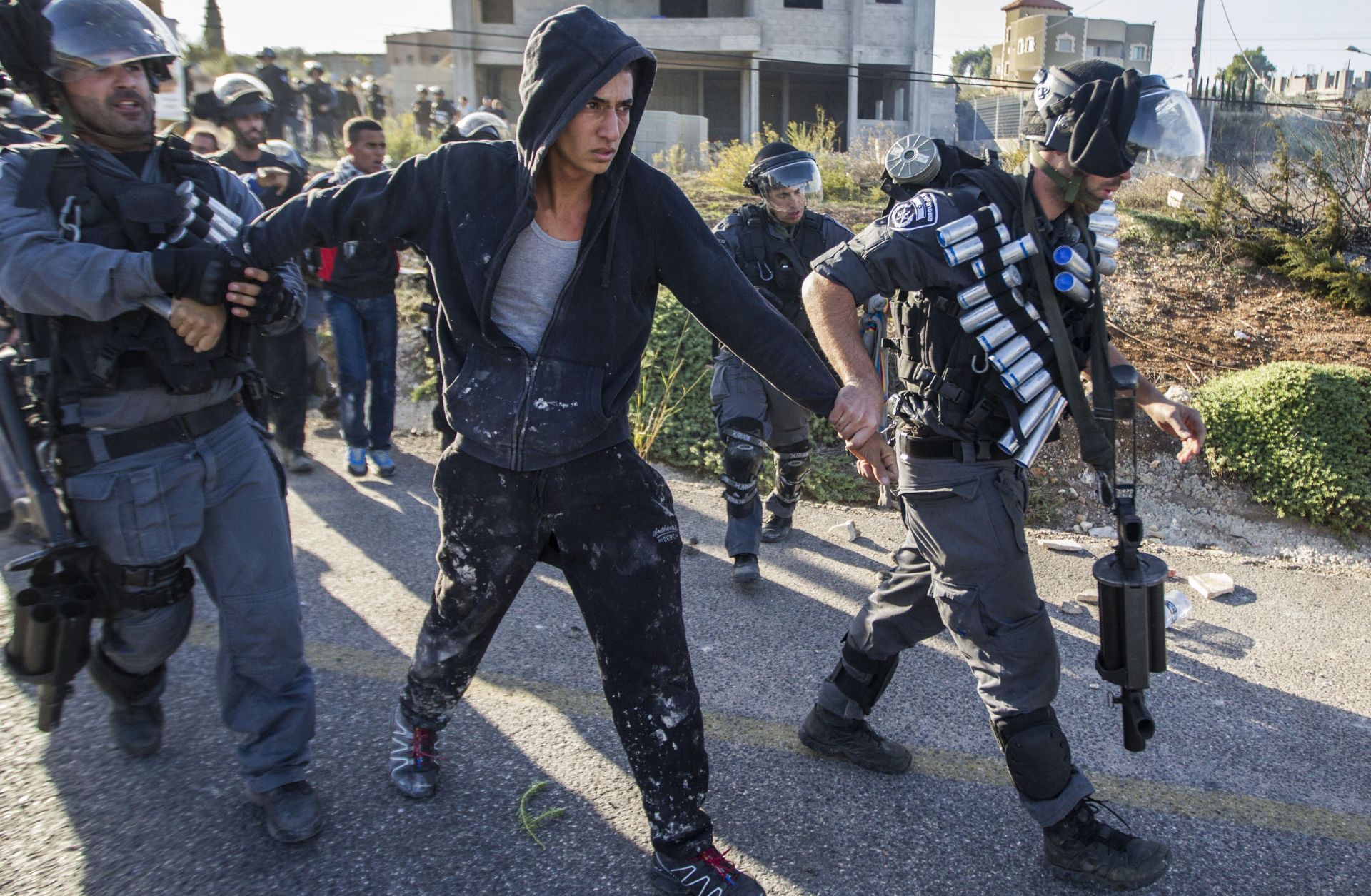 Israeli security forces detain an Arab-Israeli youth during clashes.