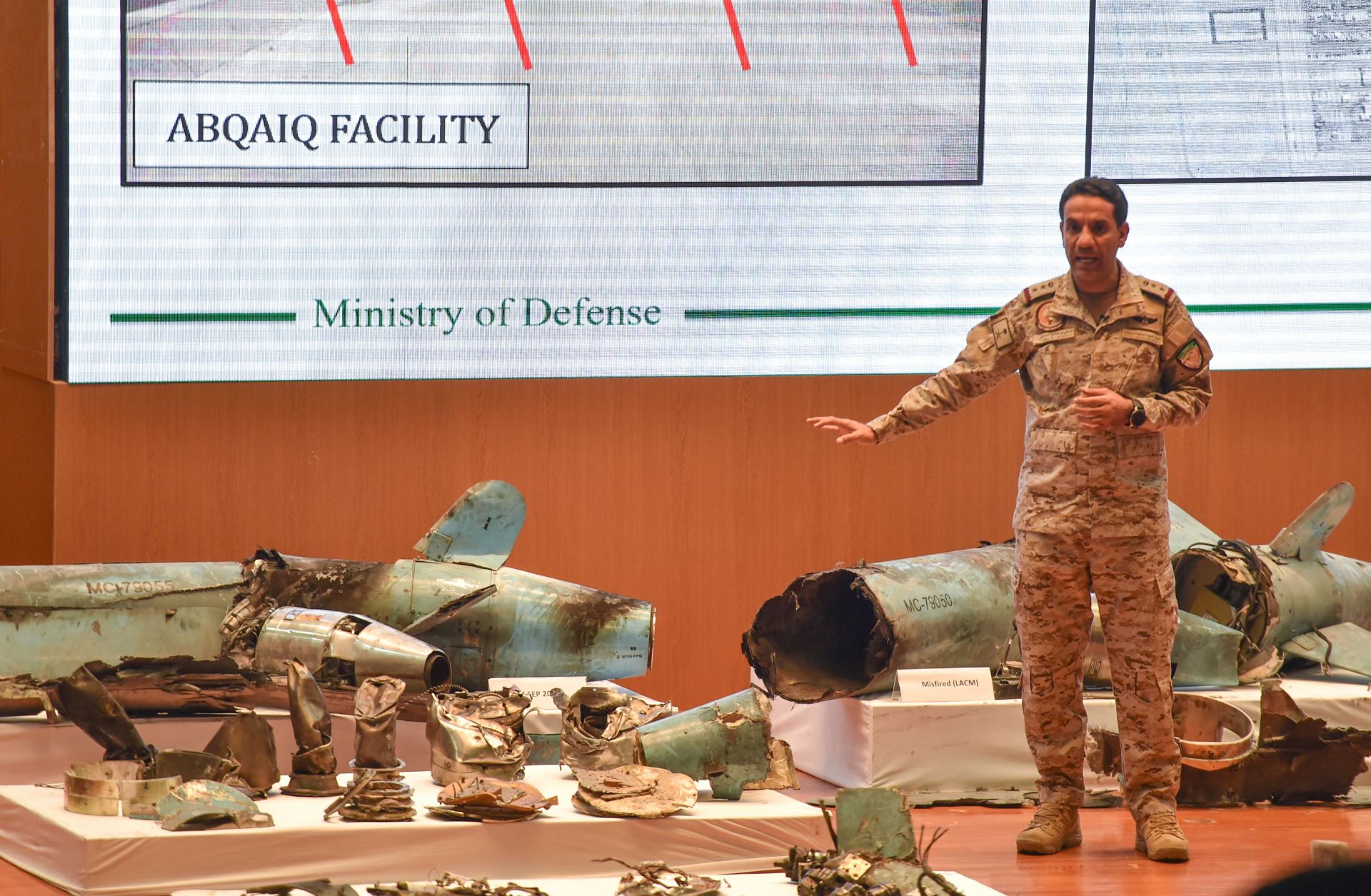 Saudi Defense Ministry spokesman Col. Turki al-Malki displays pieces of what he said were Iranian cruise missiles and drones recovered from an attack on Saudi oil facilities, during a press conference in Riyadh on Sept. 18, 2019.