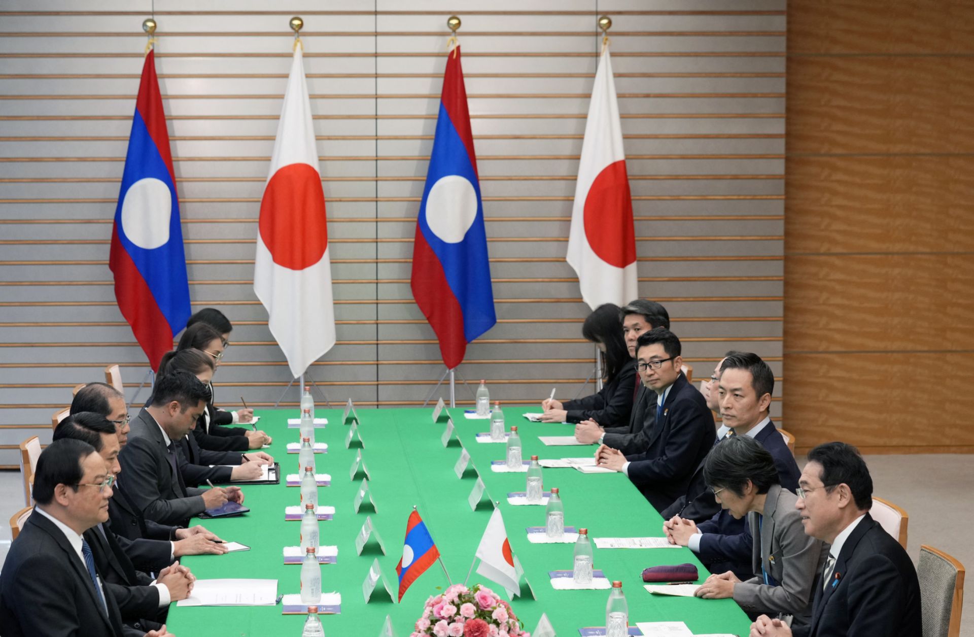 Japan's Prime Minister Fumio Kishida (R) delivers an opening address at the start of a bilateral meeting with Laos' Prime Minister Sonexay Siphandone (L) at the prime minister's official residence in Tokyo, Japan, on Dec. 16, 2023.