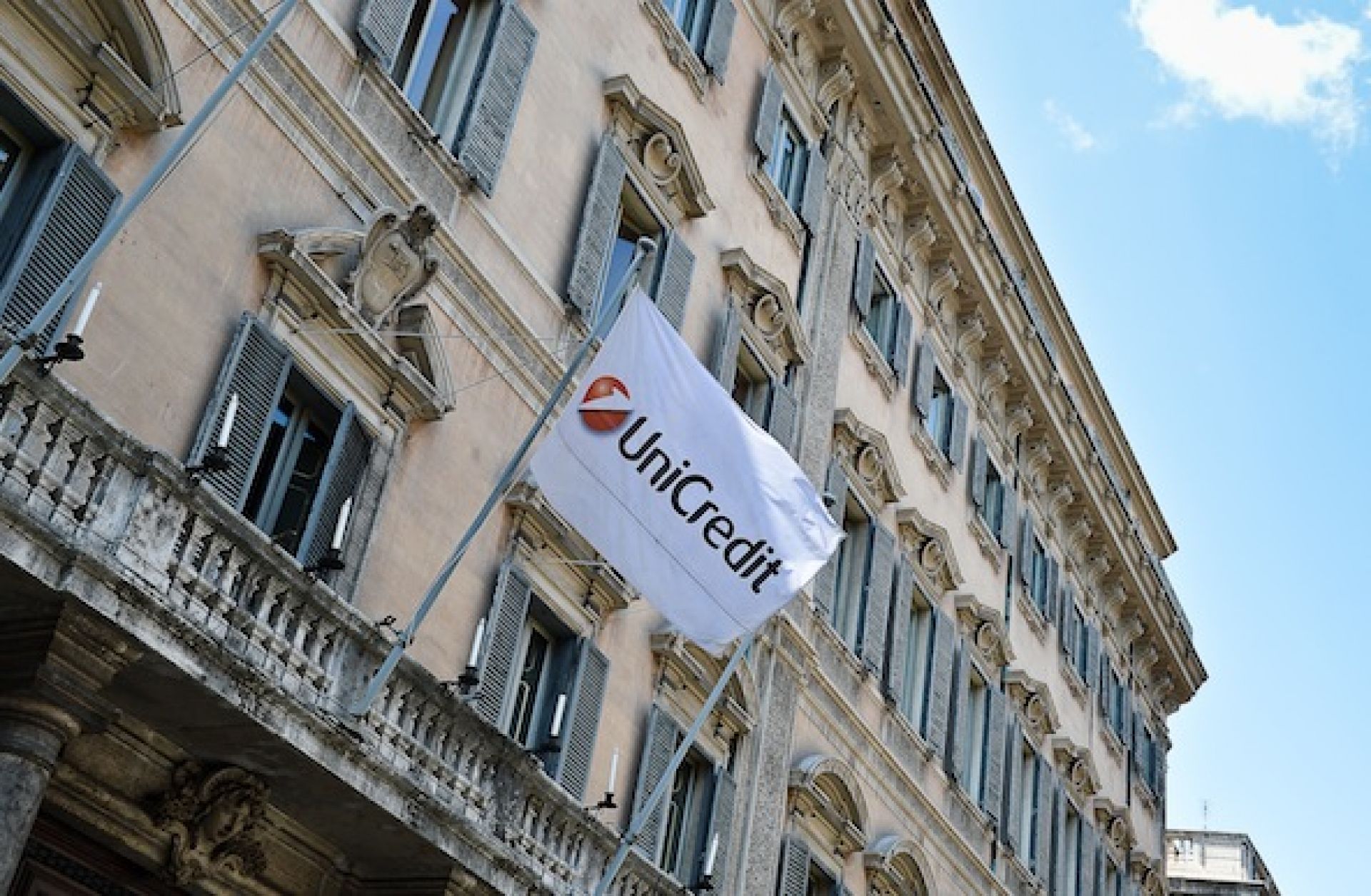  A flag bearing UniCredit's logo is shown in downtown Rome.