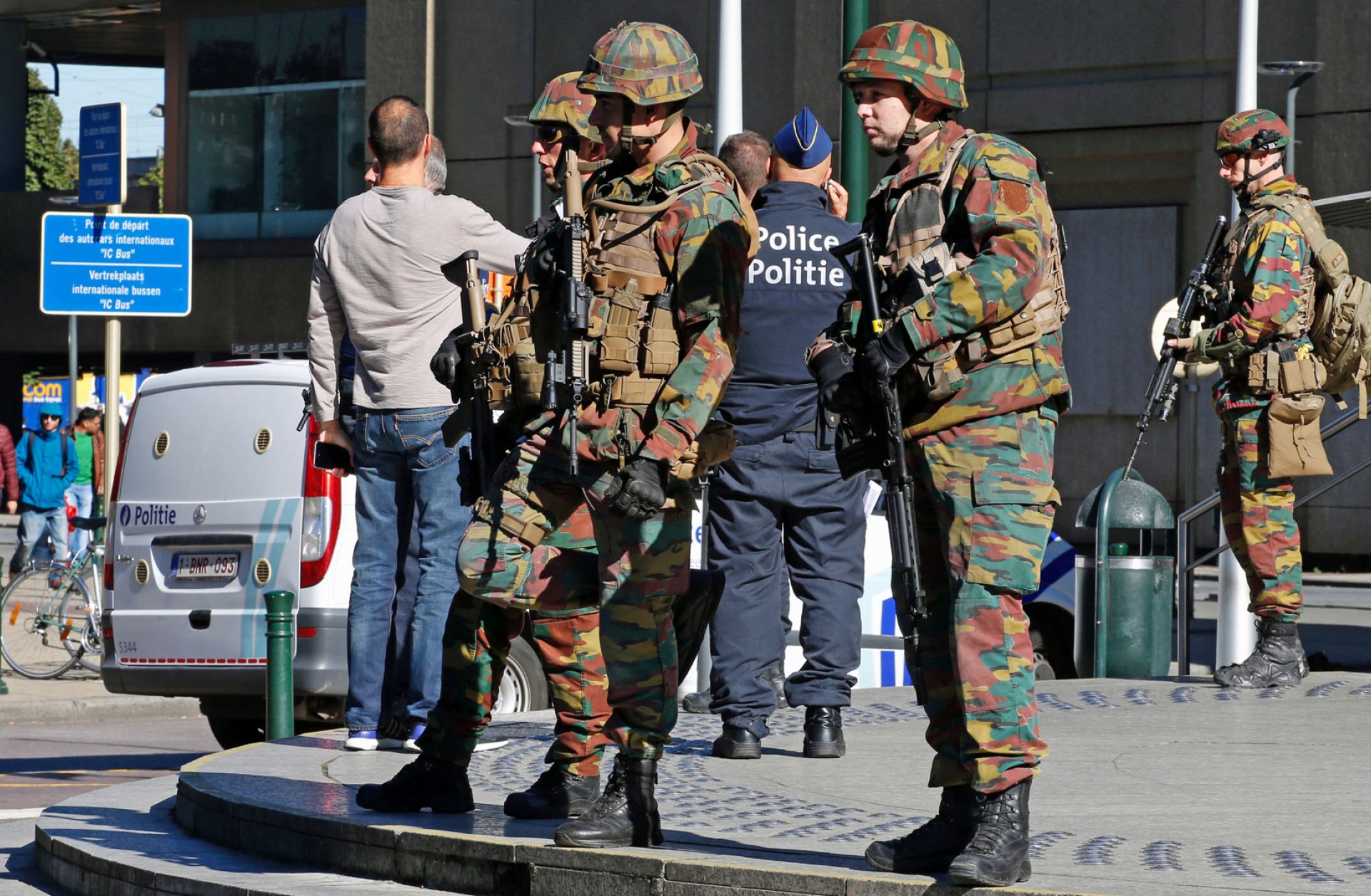 Police and army personnel on guard during a bomb alert outside the Brussels-North train station, Oct. 5.