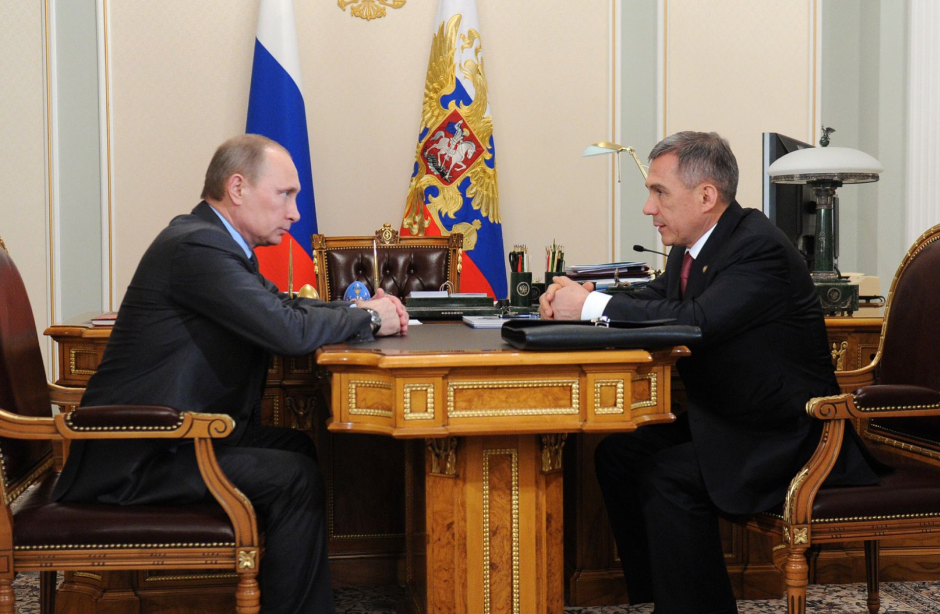 Russian President Vladimir Putin (L) can respond one of two ways to criticism from Rustam Minnikhanov, the leader of Tatarstan: Offer the republic financial concessions or purge the popular outspoken critic of his administration.