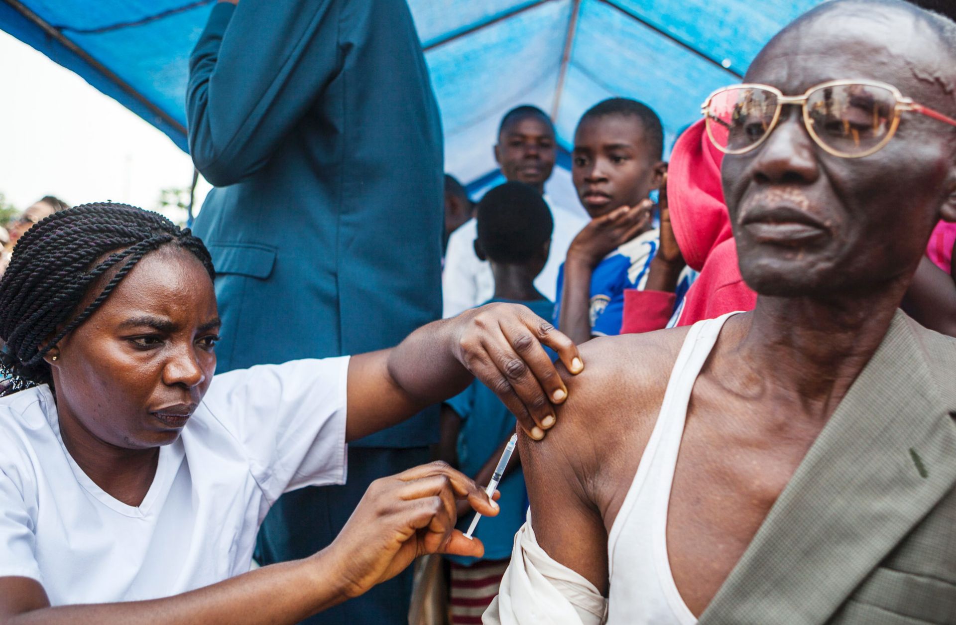 In Kinshasa, a man receives a vaccination against yellow fever, which has spread to the Democratic Republic of the Congo from Angola, where an outbreak began in late 2015. Though it has attracted far less attention than the Zika virus, an outbreak of yellow fever could turn into a global concern if it spreads along economic lines from Angola and the Democratic Republic of the Congo to China.
