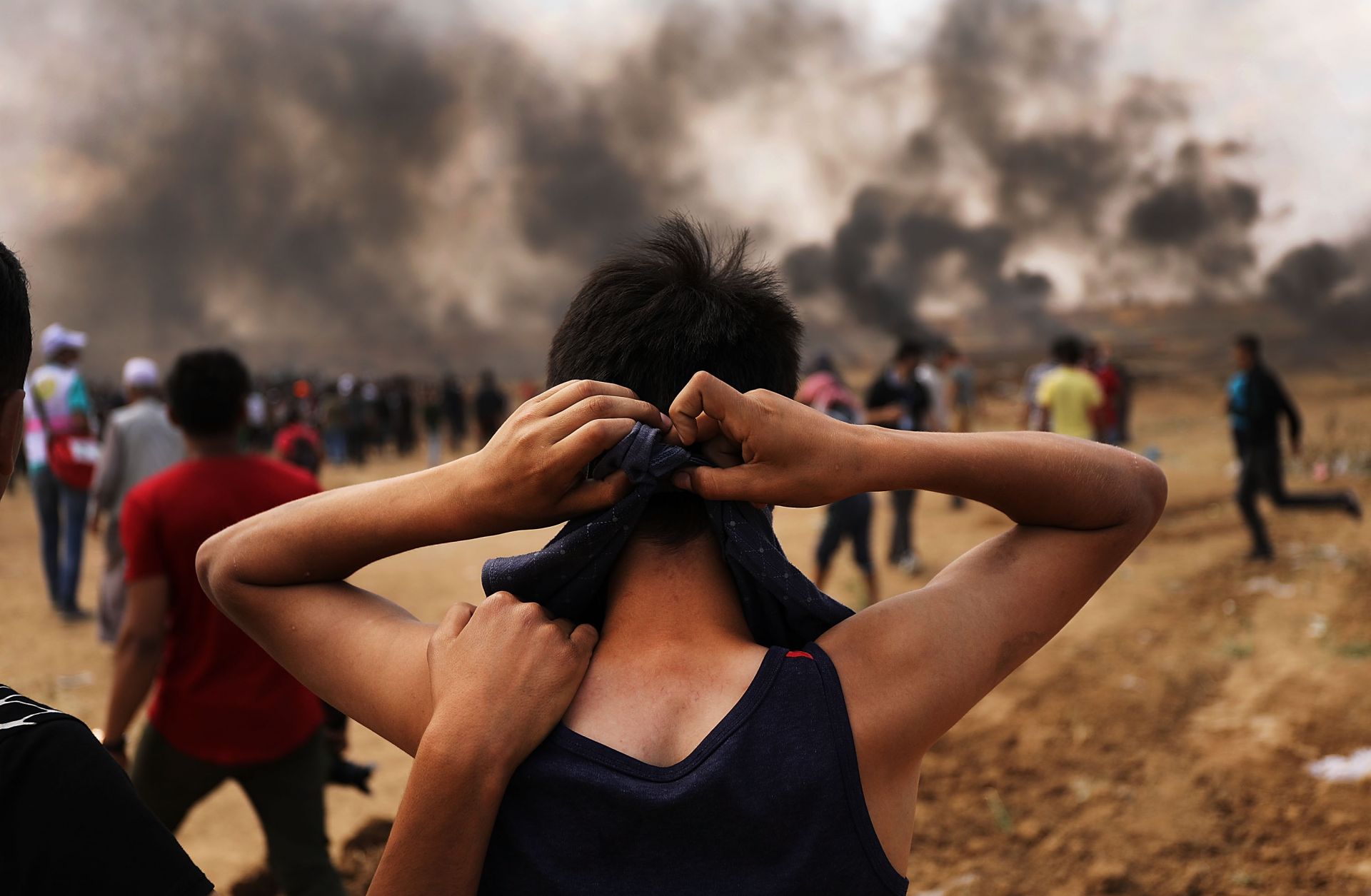 A Palestinian teenager prepares to head to the border fence with Israel amid mass demonstrations against the opening of the U.S. embassy in Jerusalem on May 14 -- the day before Ramadan -- in Gaza City.