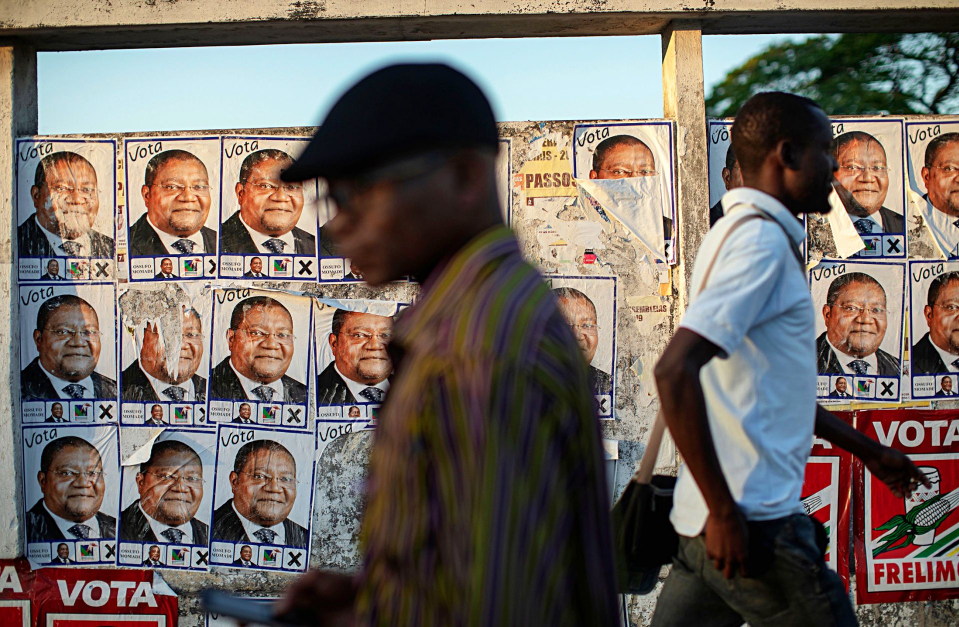Posters for Renamo's presidential candidate, Ossufo Momade, line a wall ahead of Mozambique's Oct. 15 polls. 