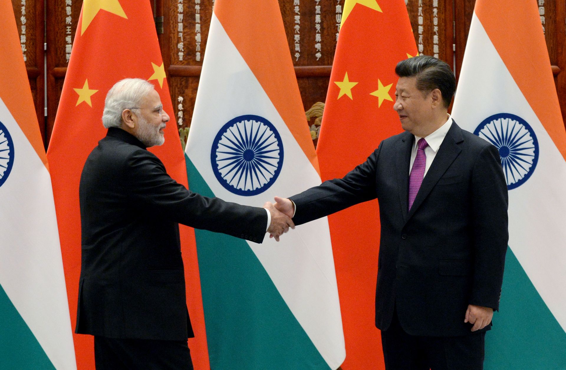 Indian Prime Minister Narendra Modi, left, shakes hands with Chinese President Xi Jinping on Sept. 4, 2016, in Hangzhou, China.