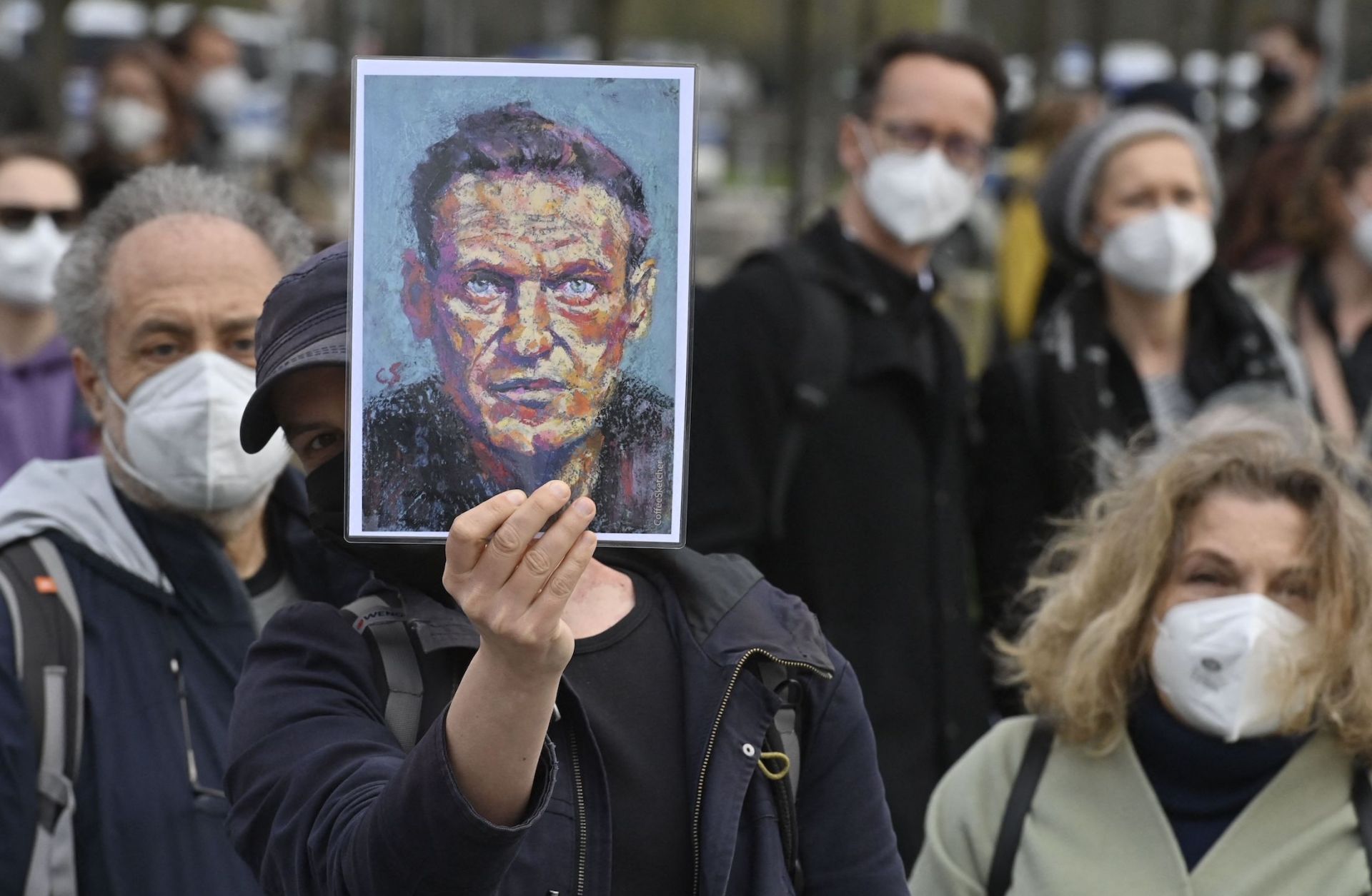 A demonstrator displays a portrait of Russian opposition leader Alexei Navalny during a protest in Berlin, Germany, on April 21, 2021.