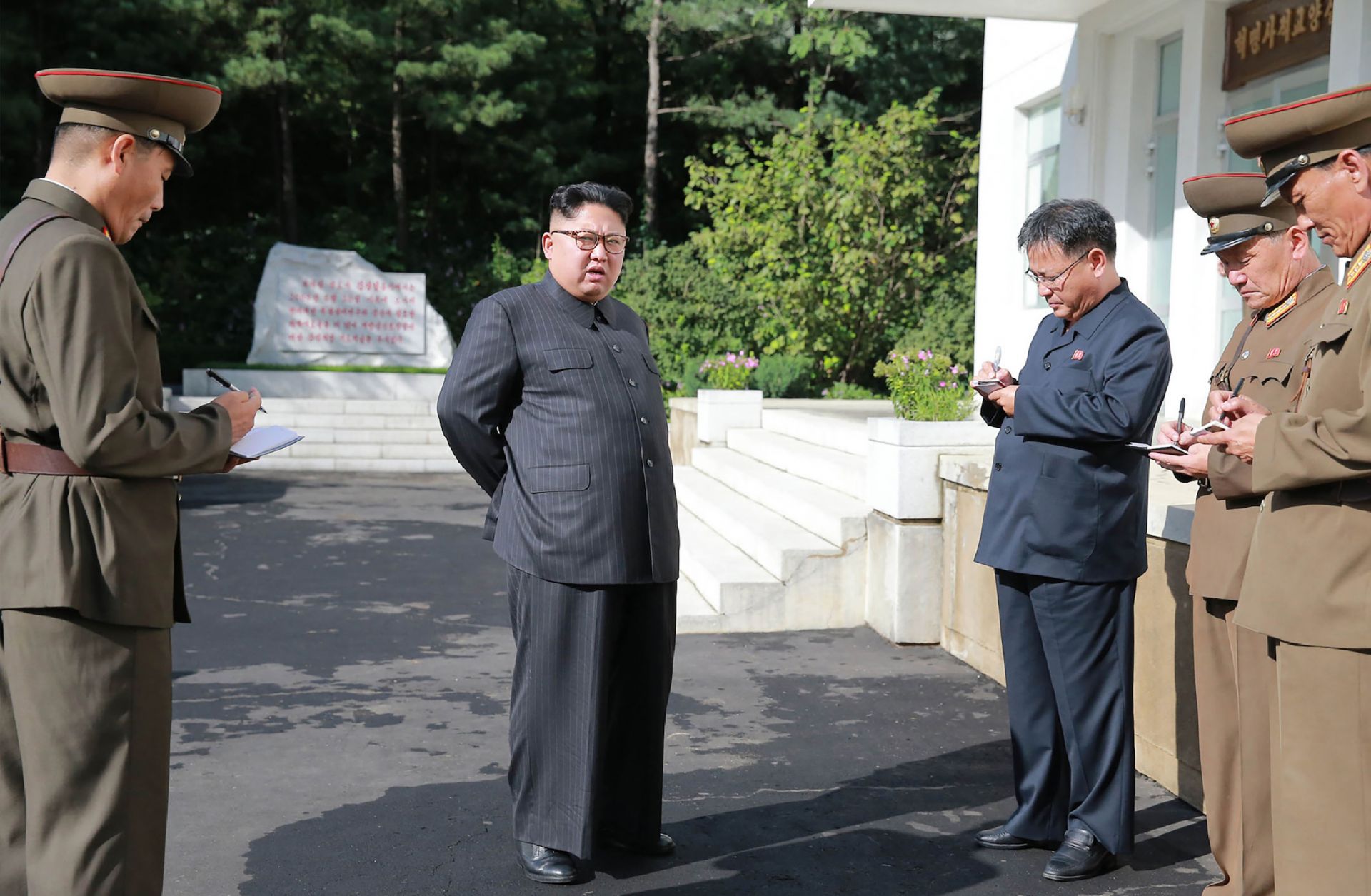 In this photo, North Korean leader Kim Jong Un visits the Chemical Material Institute of the Academy of Defense Science at an undisclosed location.