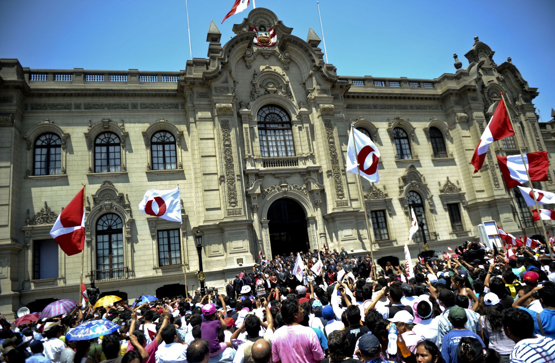 Peruvians gather outside the presidential palace in Lima