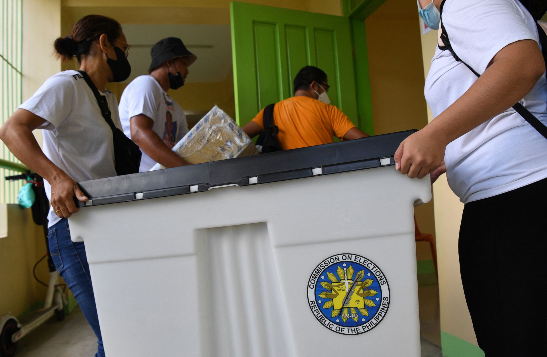 Poll workers carry a ballot box on May 4, 2022, at a polling station during preparations ahead of the May 9 presidential election in Manila, Philippines.A look at what the coming week will bring -- and a list of recommended RANE articles from the week that was.