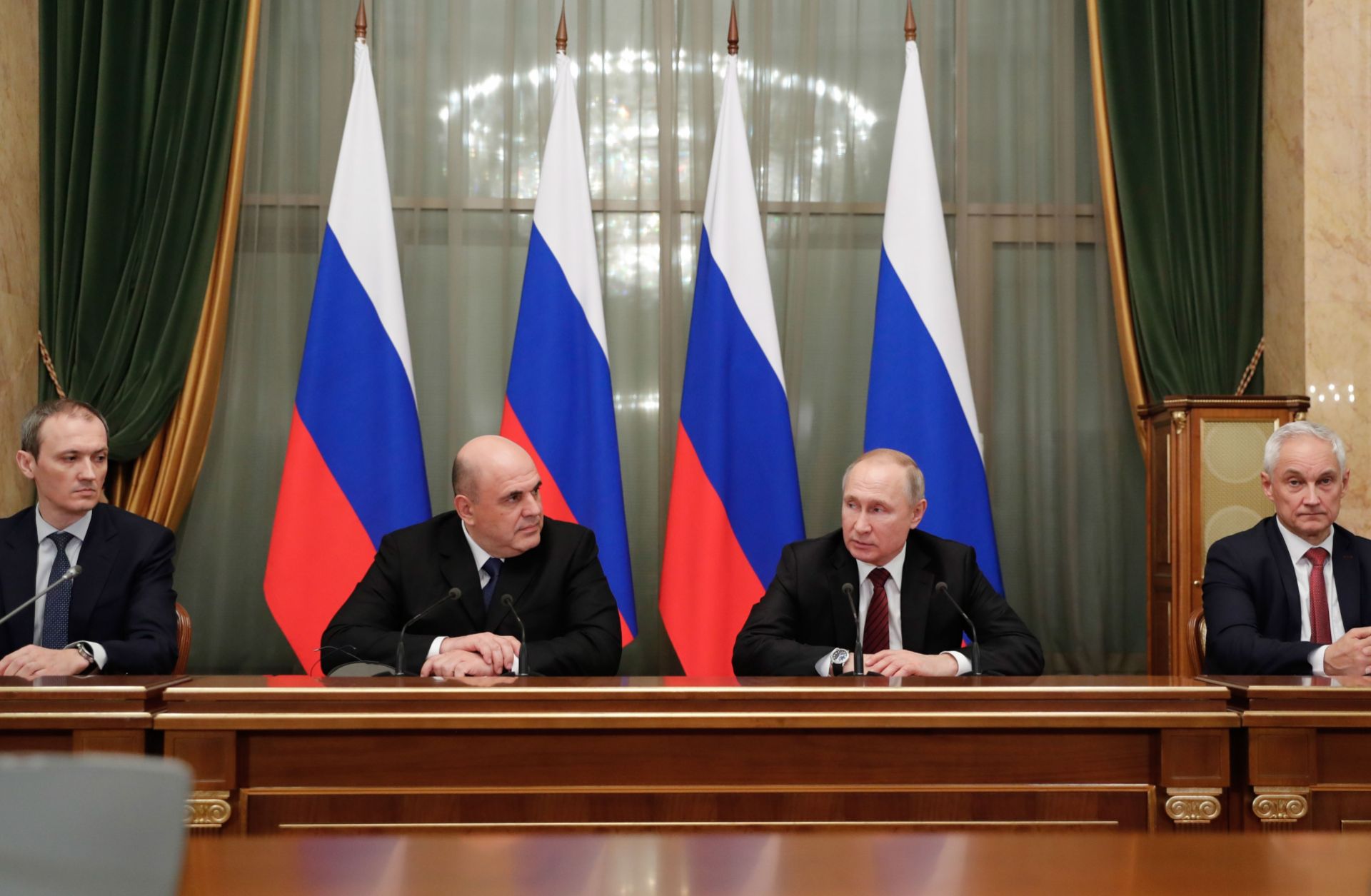 Russian President Vladimir Putin (2R) and Prime Minister Mikhail Mishustin (2L) meet with members of the new government in Moscow on Jan. 21, 2020. 