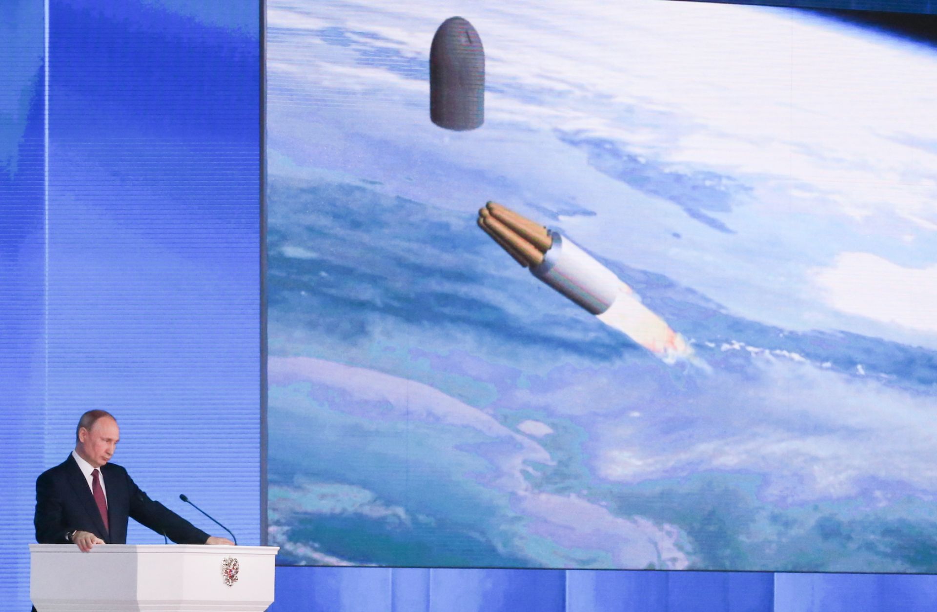 This photo shows Russian President Vladimir Putin with an image of a strategic missile