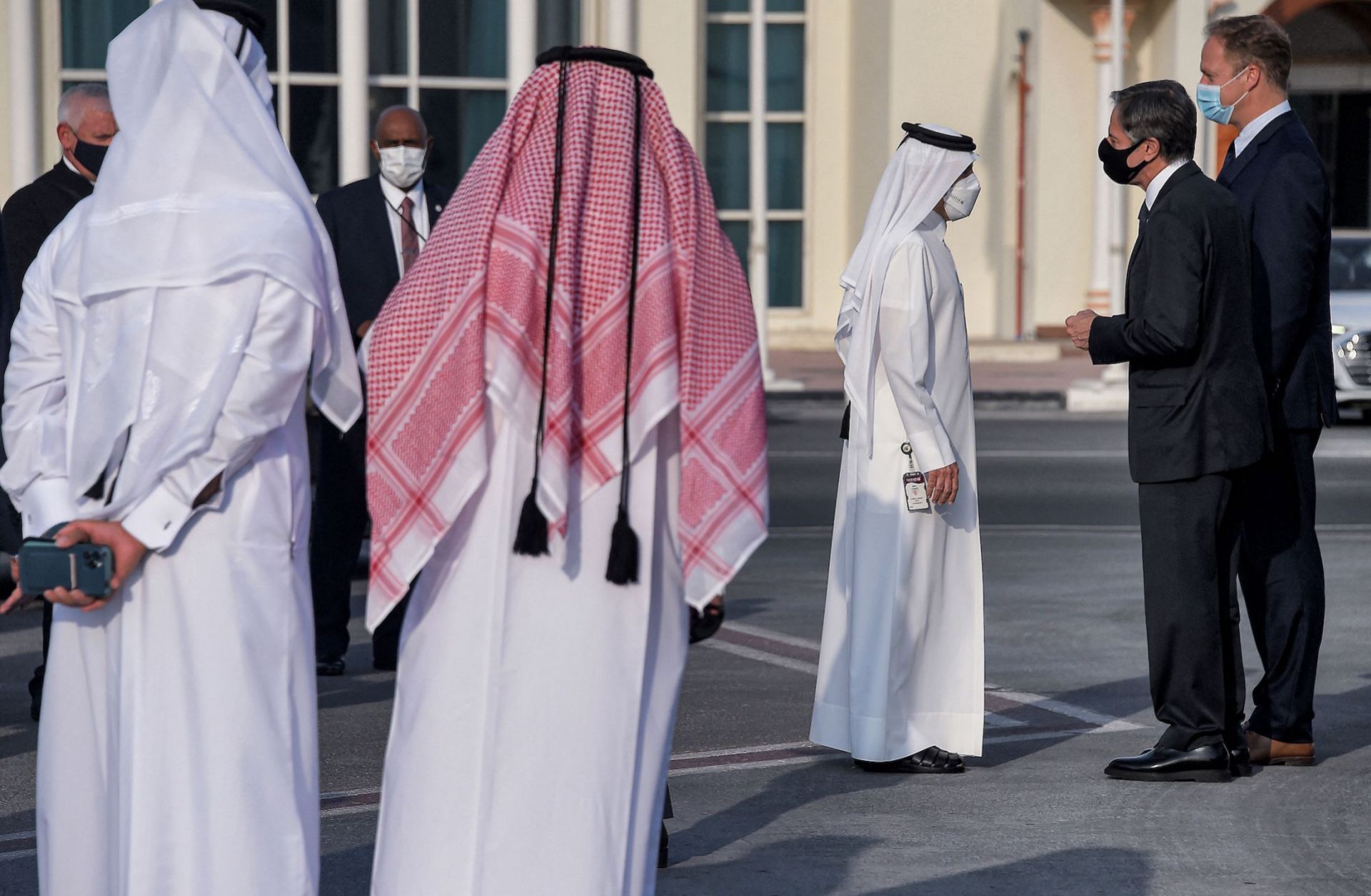 U.S. Secretary of State Antony Blinken speaks with Qatari government officials before boarding an aircraft in Doha on Sept. 8, 2021. 