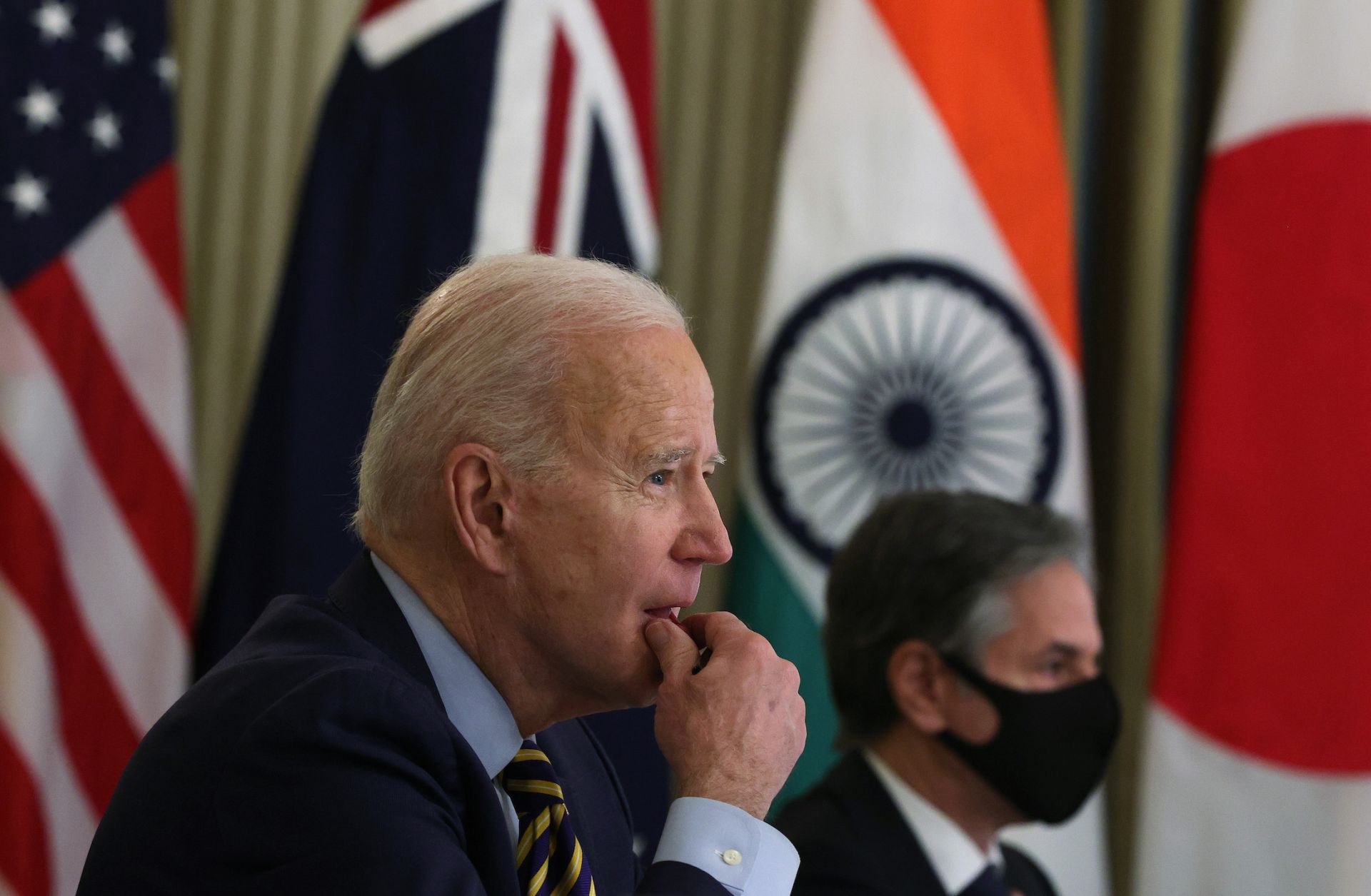 U.S. President Joe Biden (L) and U.S. Secretary of State Antony Blinken in a virtual meeting with other leaders of the QUAD on March 12, 2021, at the White House.