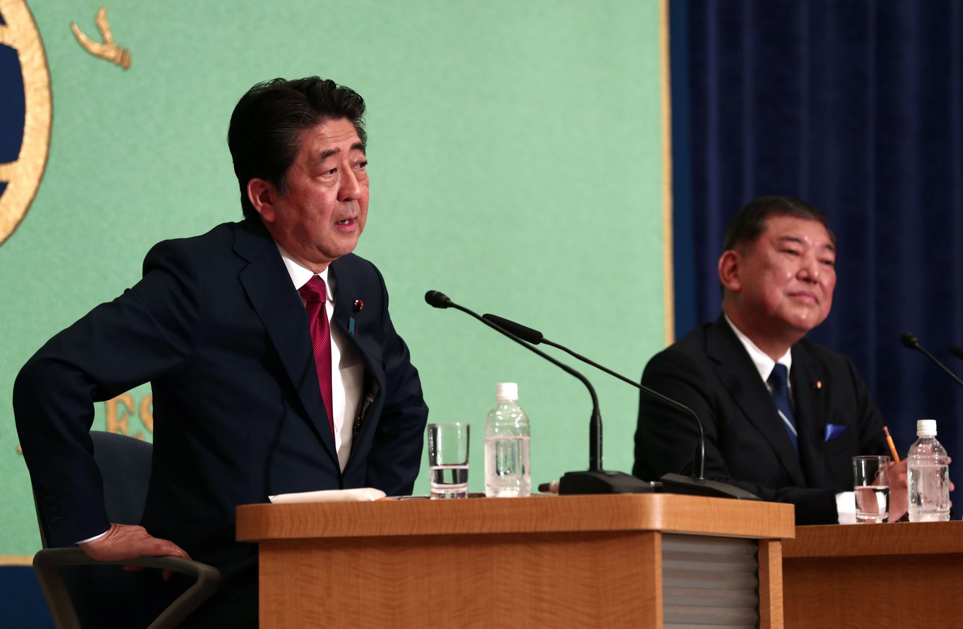Japanese Prime Minister Shinzo Abe, left, and former Defense Minister Shigeru Ishiba debate in Tokyo on Sept. 14, 2018.