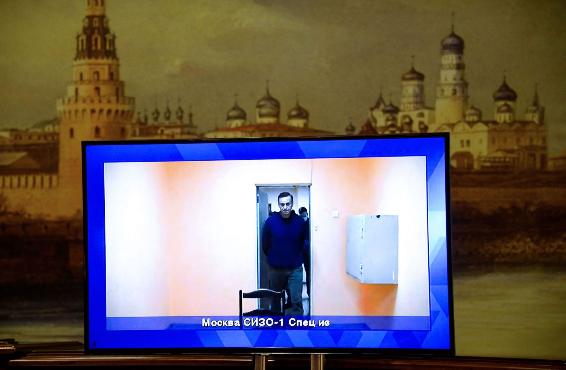 Opposition leader Alexei Navalny on Jan. 28, 2021, appears on a screen set up at a hall of the Moscow Regional Court.