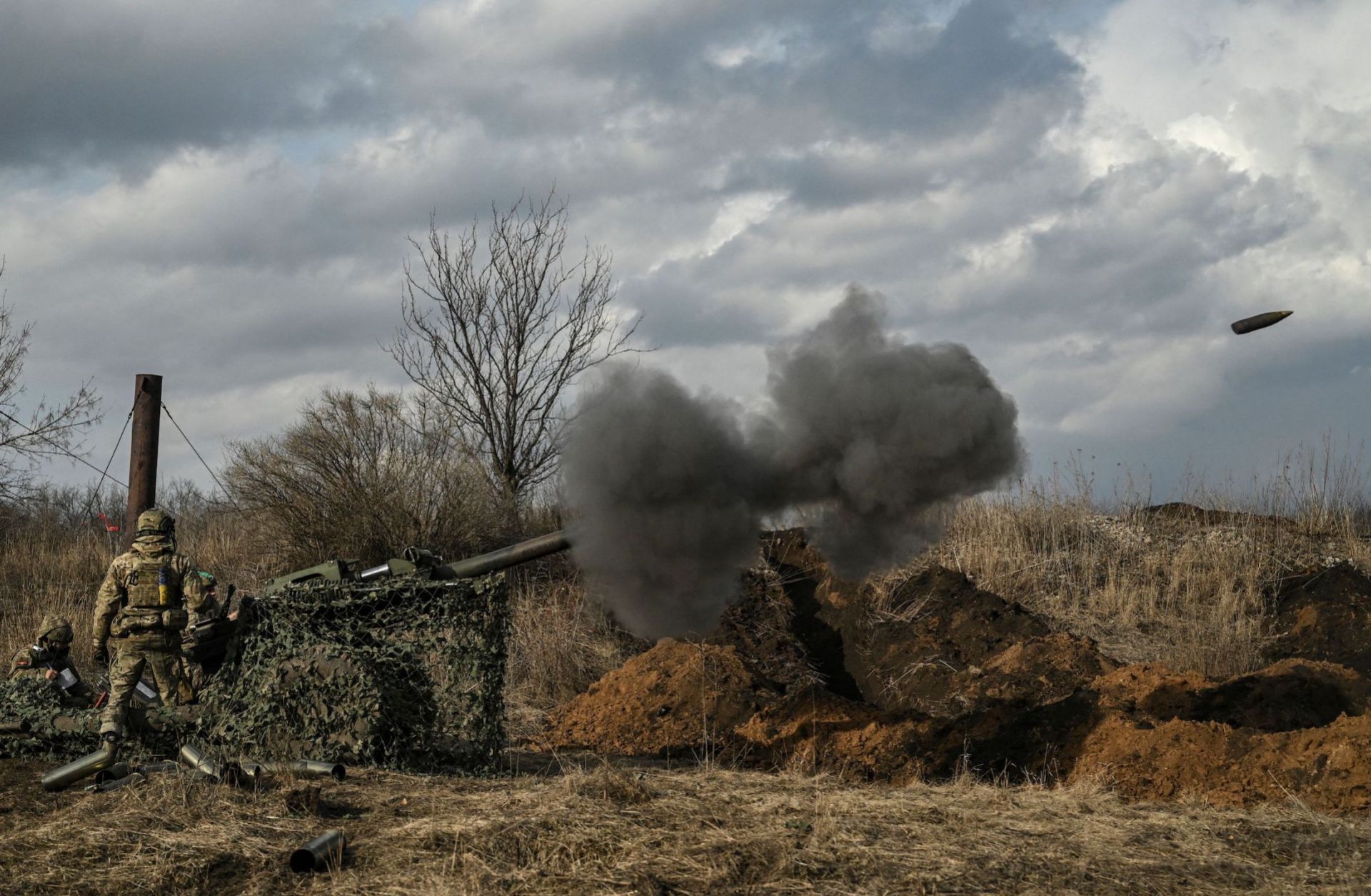 Ukrainian servicemen fire with a 105mm howitzer toward Russian positions near the city of Bakhmut on March 8, 2023, amid the Russian invasion of Ukraine.