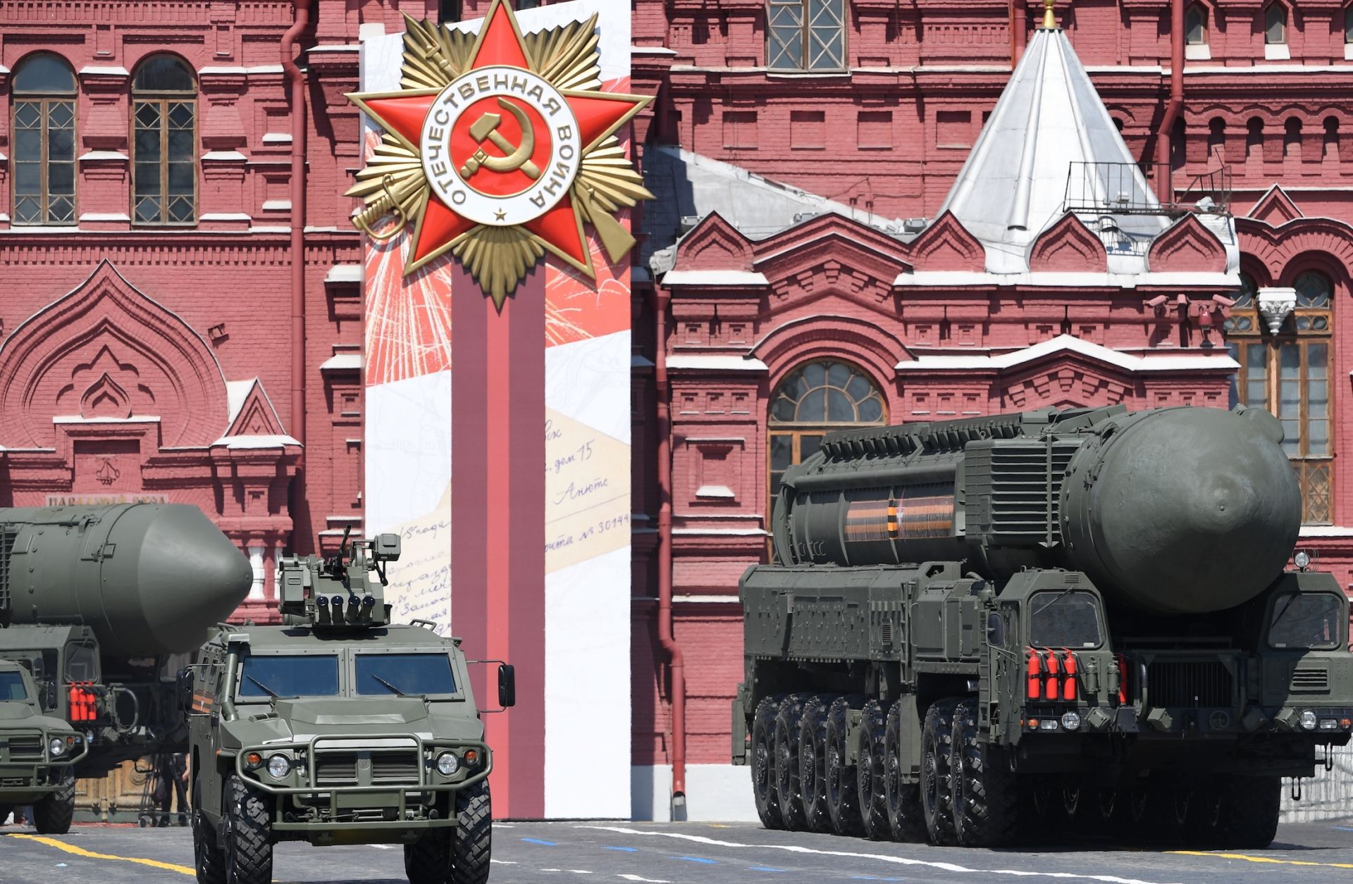 An intercontinental ballistic missile launcher and an armored vehicle are displayed during a military parade in Moscow, Russia, on June 24, 2020, to commemorate the 75th anniversary of Russia’s victory in World War II.