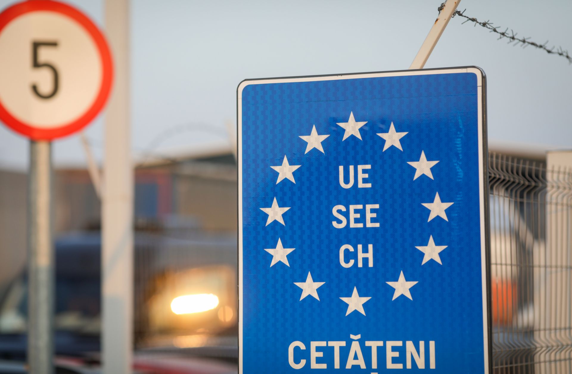 A blue EU sign is seen at a Romanian border crossing.