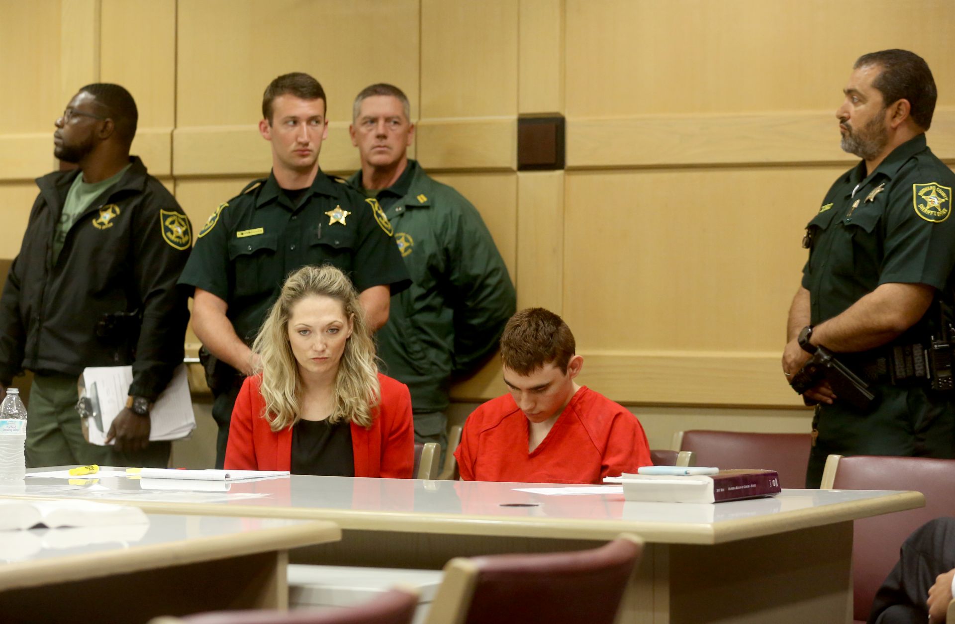 Nikolas Cruz sits in court during a hearing. He is charged with killing 17 people in a school shooting on Feb. 14.