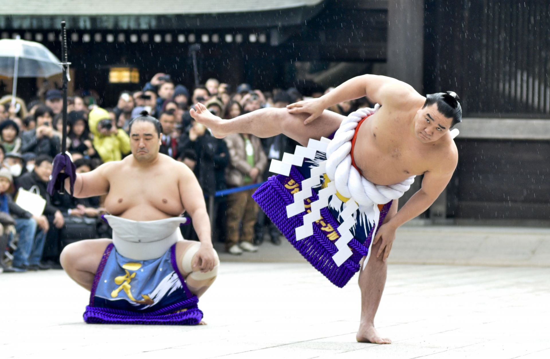 Mongolian-born Harumafuji Kohei (r) is one of only 72 sumo wrestlers in the centuries-old history of the sport to attain the rank of yokozuna, or grand champion.