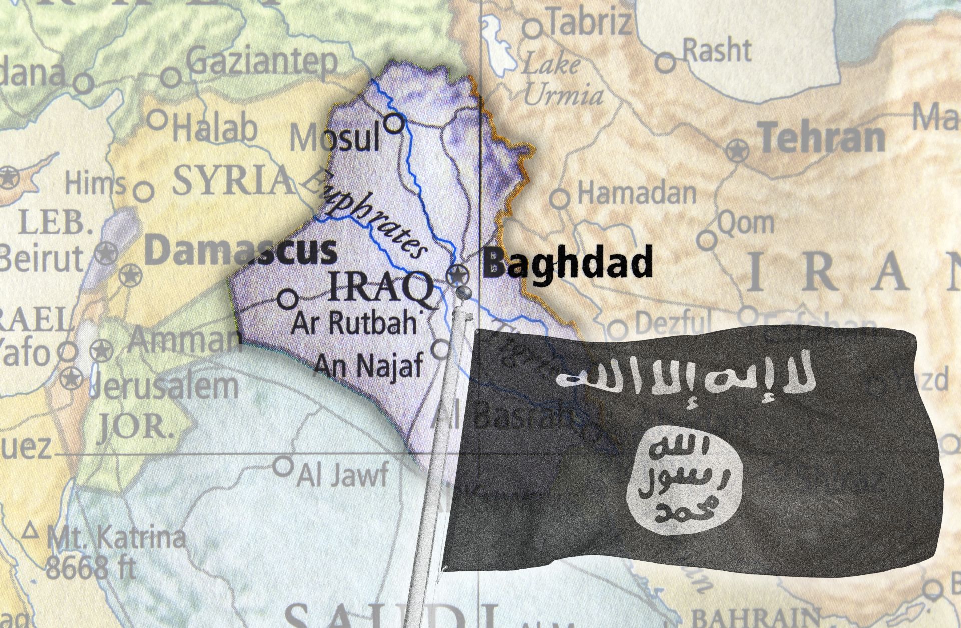 An image of the Islamic State flag overlays a map of Iraq.