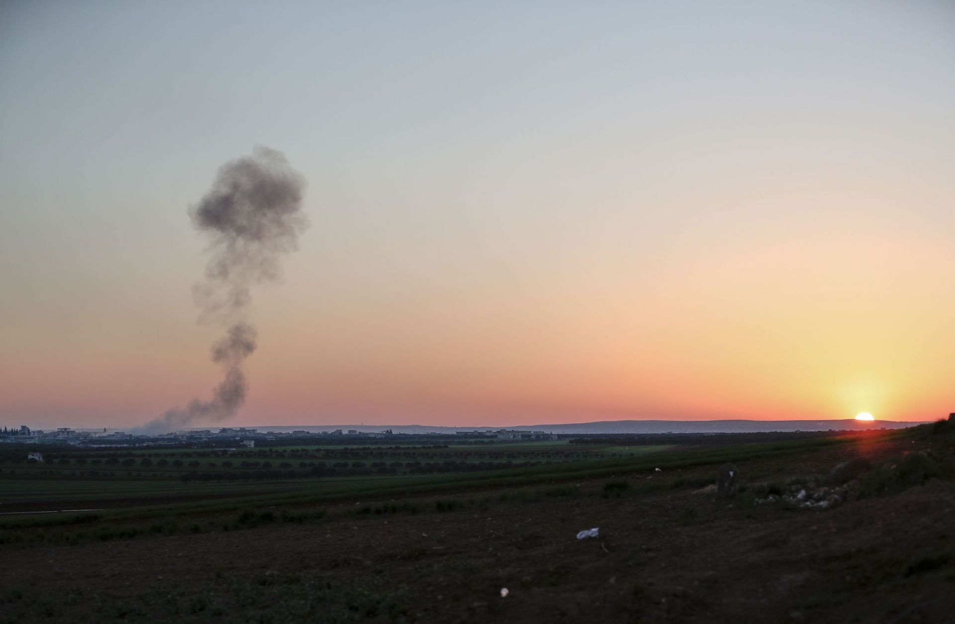Smoke billows above a Syrian village following an airstrike raid on March 3, 2020. Smoke billows above a Syrian village following an airstrike raid on March 3, 2020.