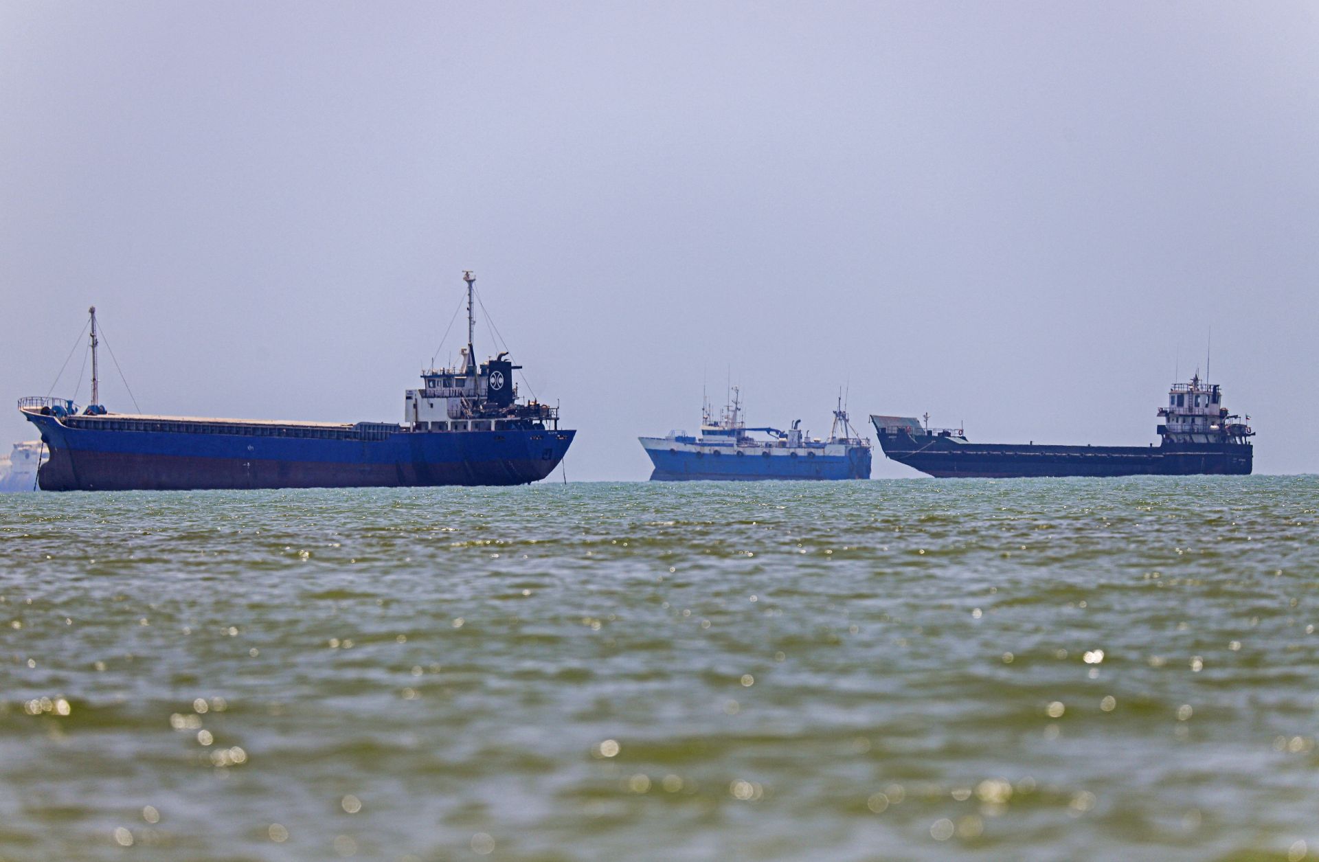 Vessels are seen anchored along the Strait of Hormuz on June 18, 2026. 