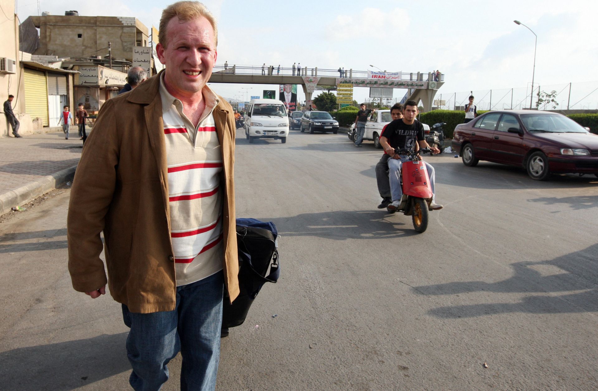 A tourist is a little too obvious as he walks away from Rafik Hariri International Airport in Beirut.