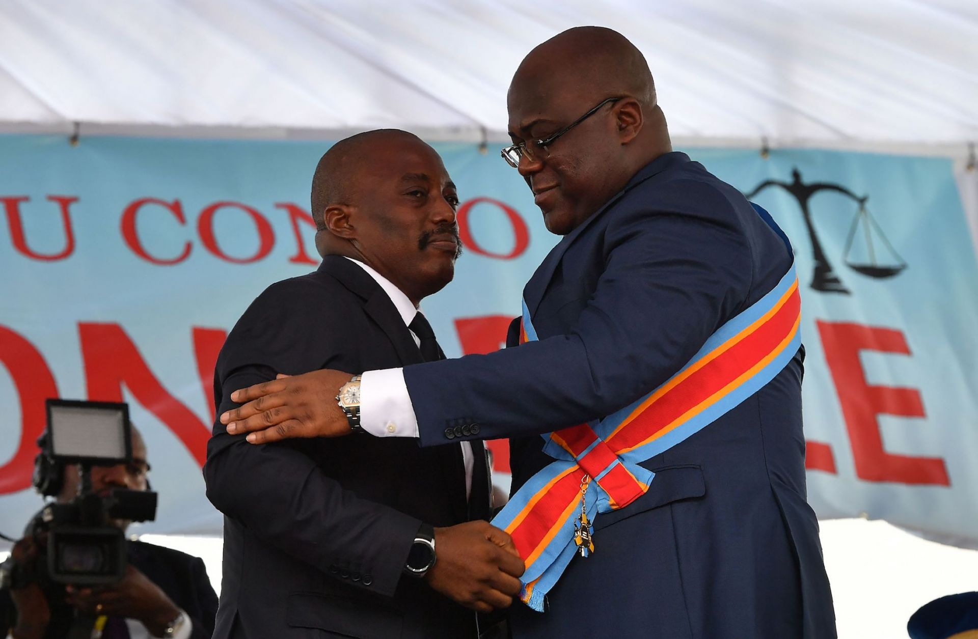 Outgoing Democratic Republic of the Congo President Joseph Kabila (L) embraces newly inaugurated President Felix Tshisekedi on Jan. 24, 2019, in Kinshasa.