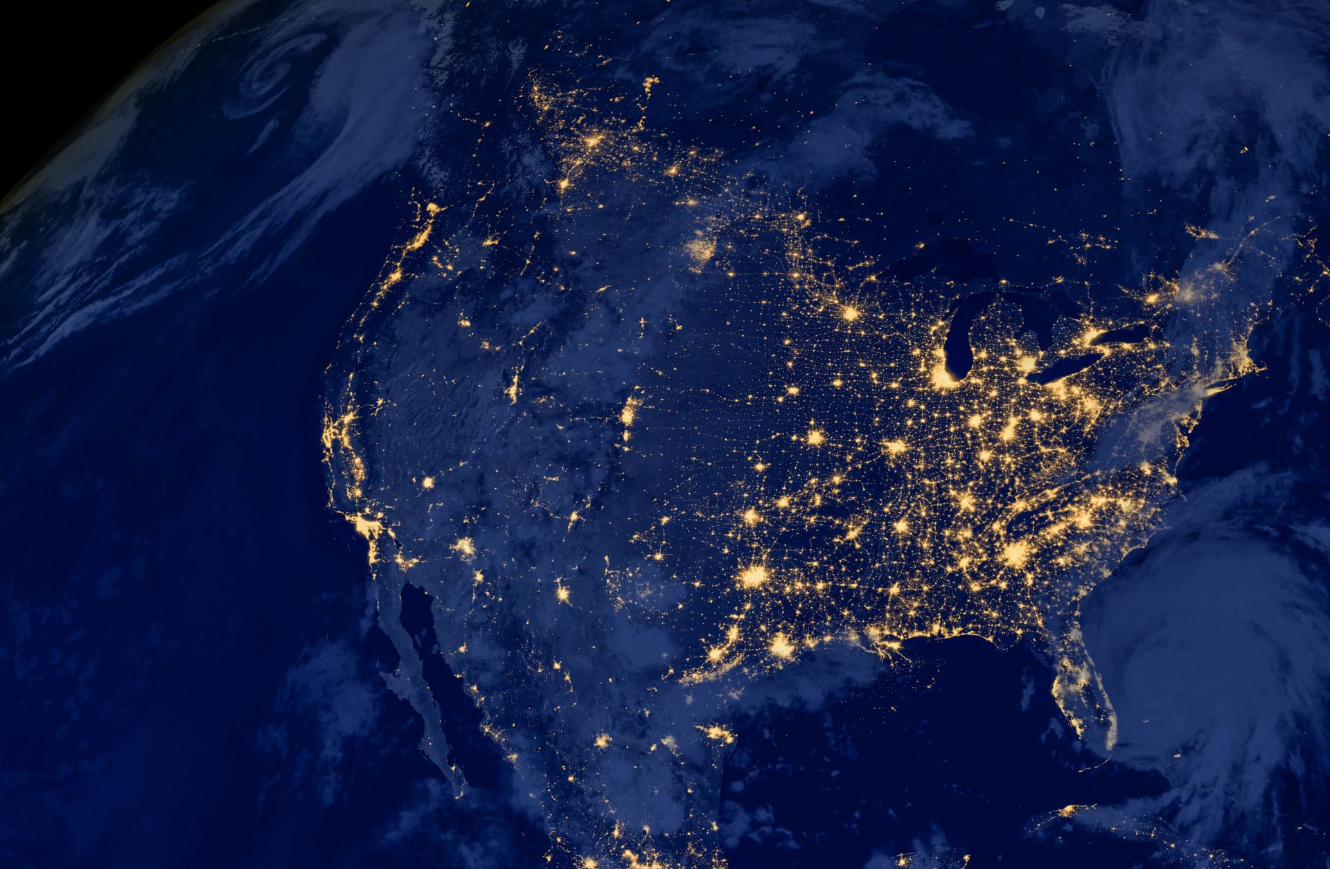 A satellite image of the United States at night. A satellite image of the United States at night.
