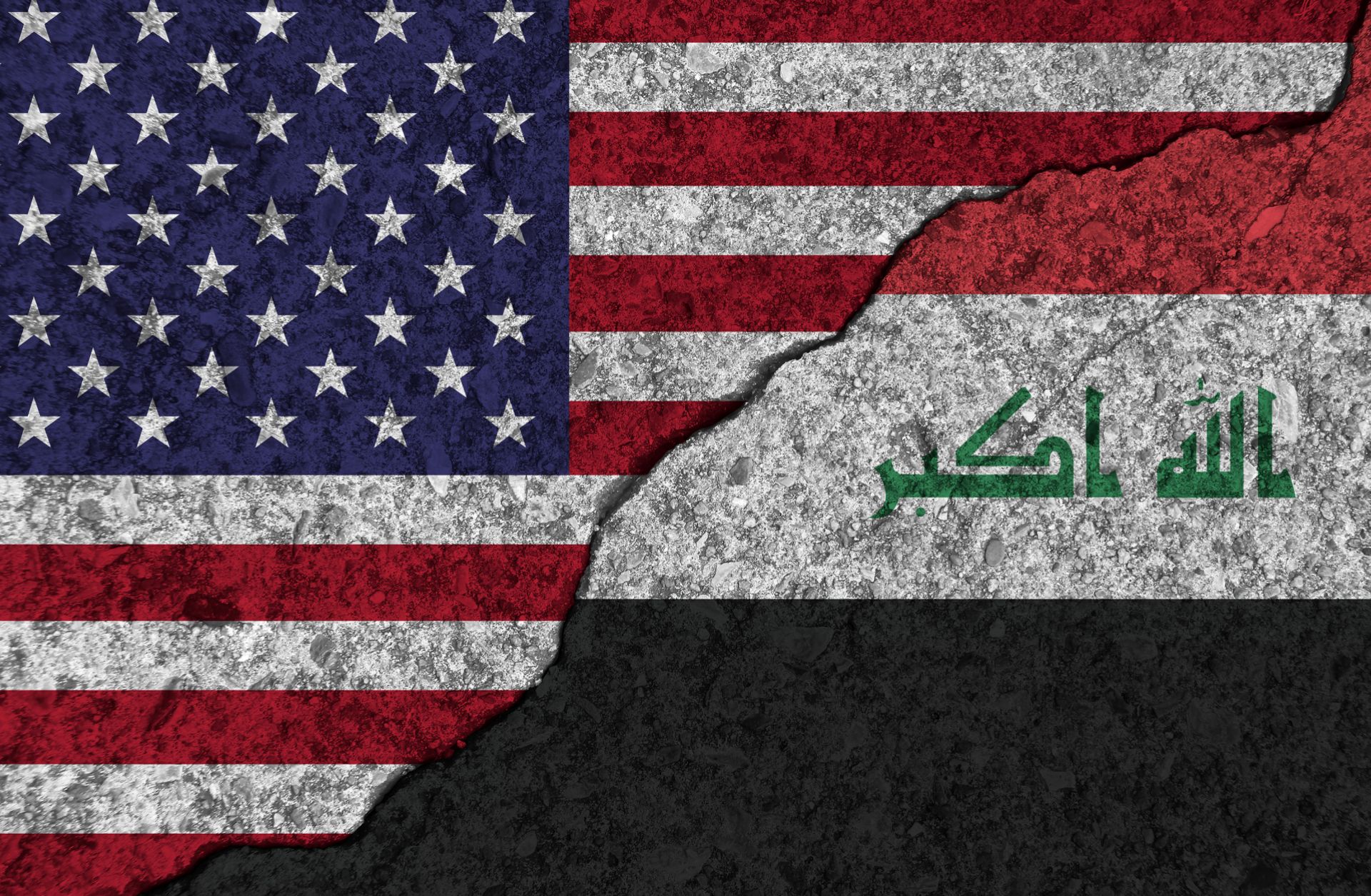 An image of cracked, painted picture of the U.S. and Iraqi flags illustrates the two countries' decaying relationship due to Washington's ongoing pressure campaign and proxy battle against Iran.  