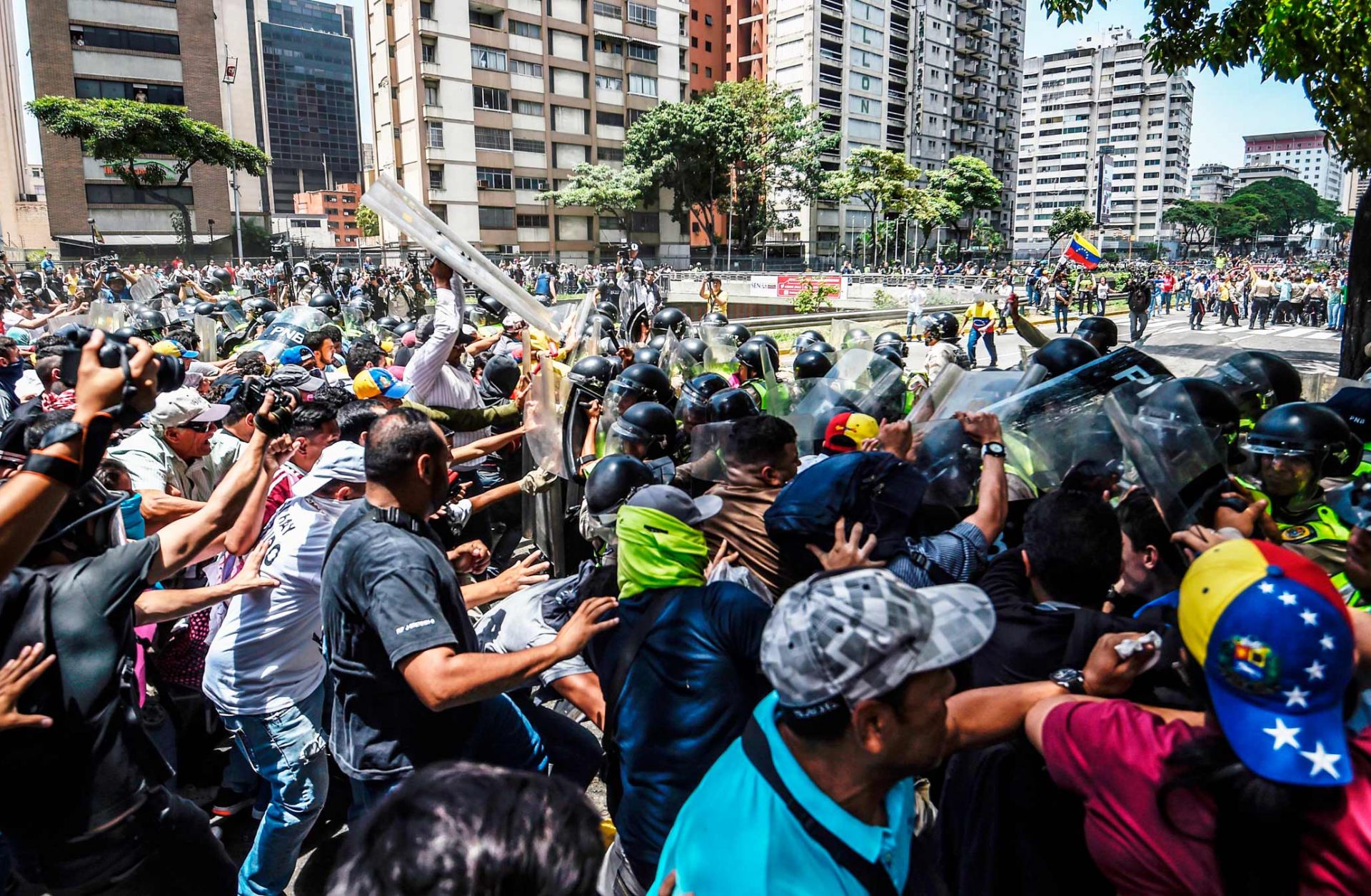 A default by Petroleos de Venezuela on its debt would likely hamper oil production, leading to tighter food supplies and stirring up further unrest in Venezuela.