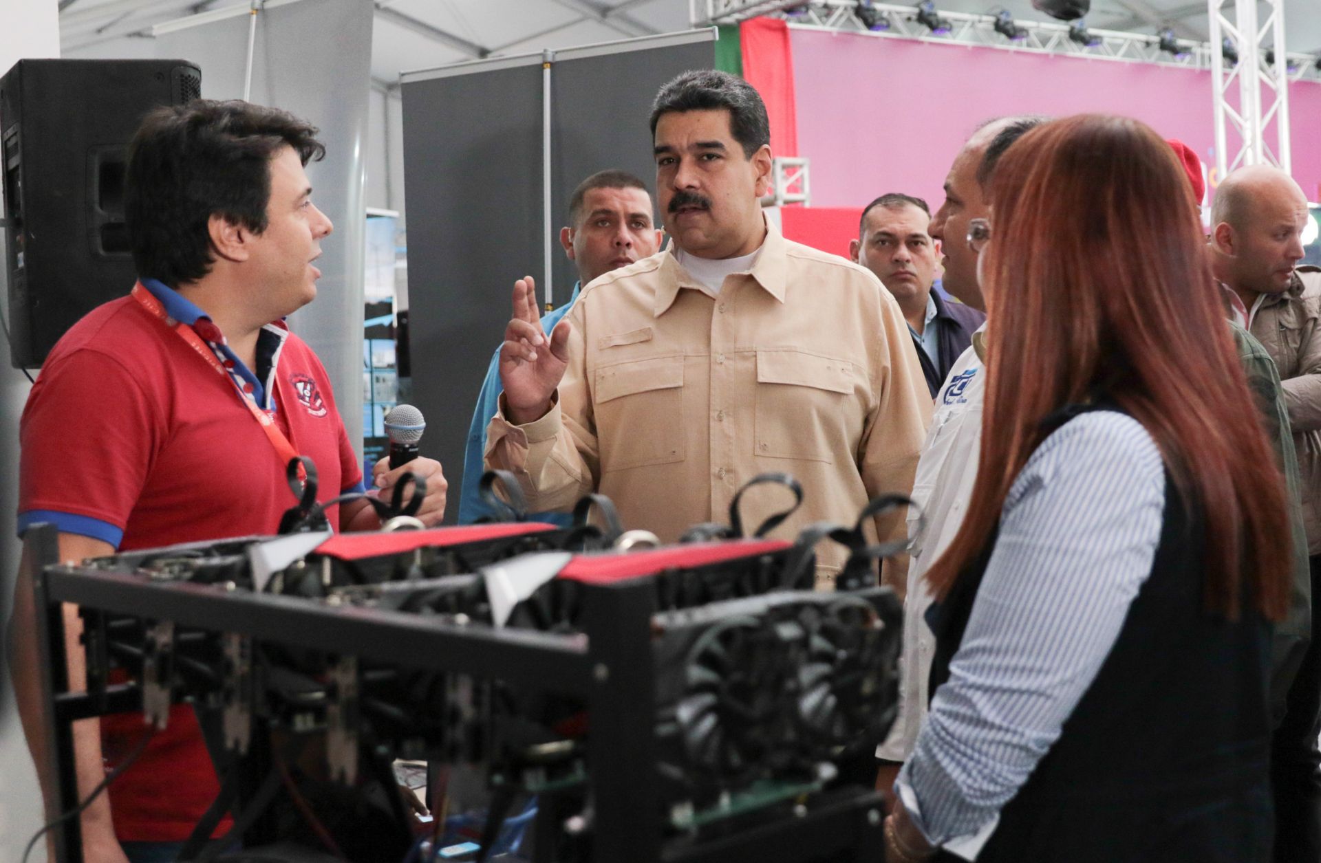 President Nicolas Maduro (C) of Venezuela attends the International Science and Technology Fair in Caracas on Dec. 3.
