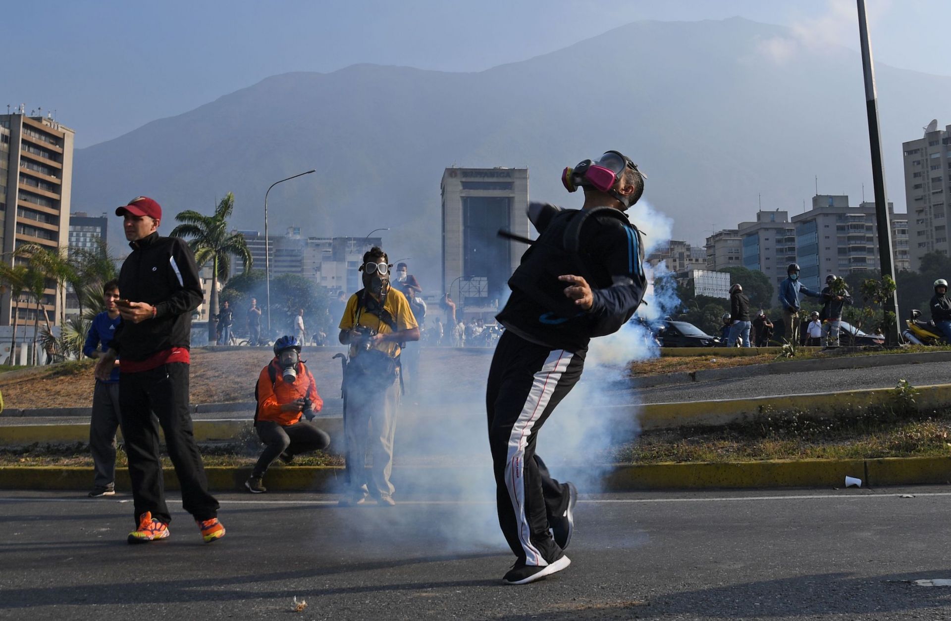 Opposition supporters clash with Venezuelan security forces in Caracas on April 30, 2019.