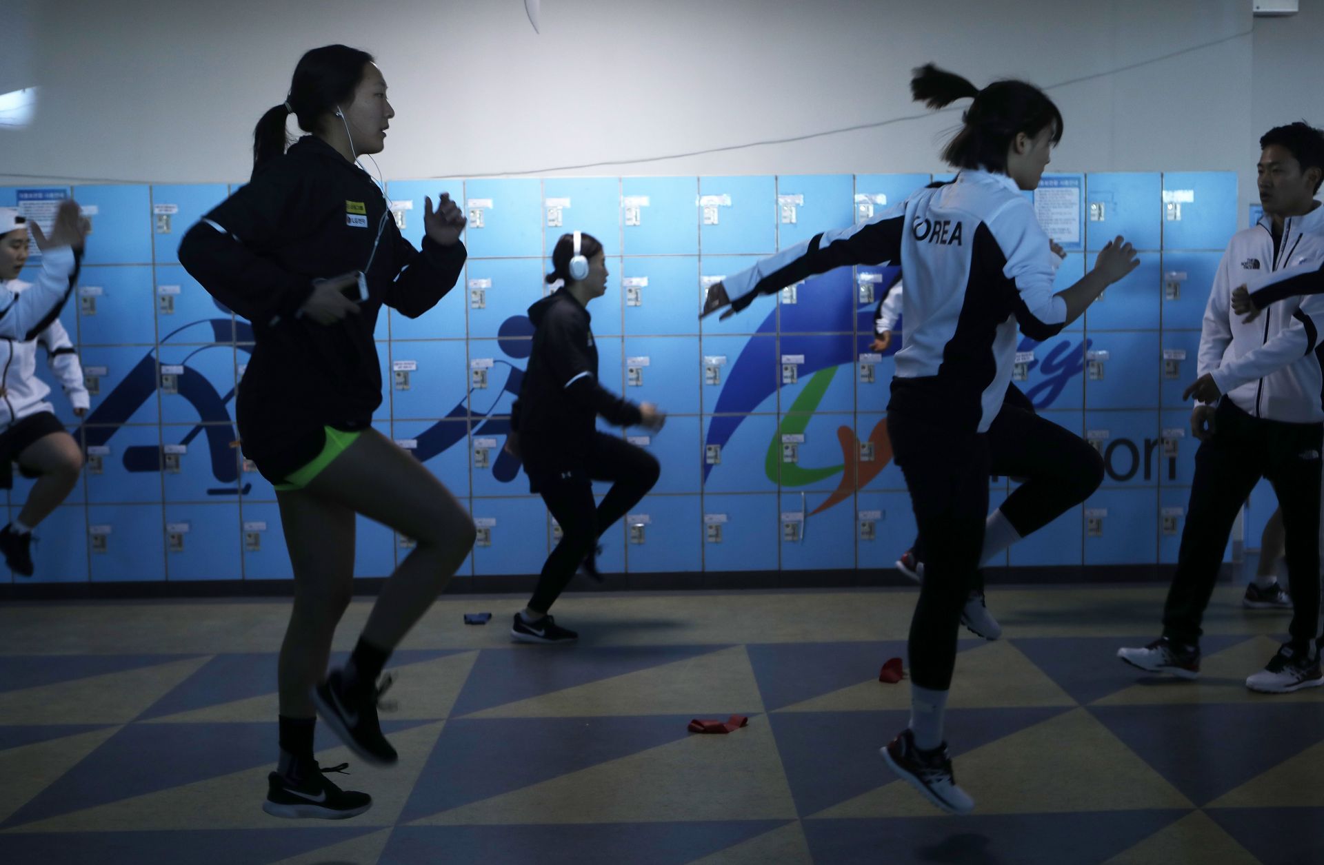 Members of the Korean women's ice hockey team warms up before a match days before the 2018 Winter Olympics, where they will compete as a unified team for the first time in Olympic history. 