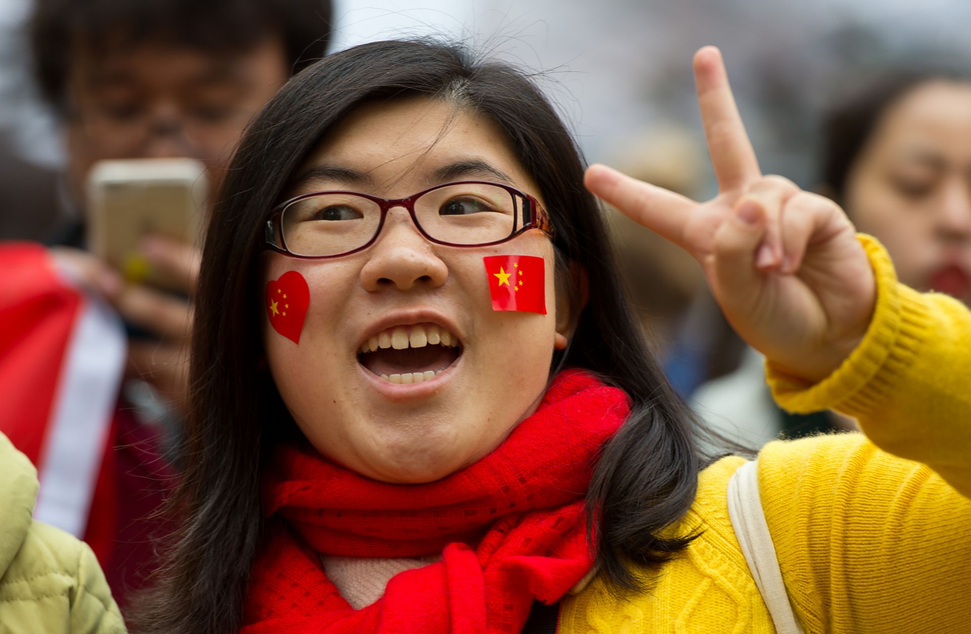 A demonstrator shows support for the Chinese government at a counterprotest held in response to an Amnesty International demonstration over human rights abuses and online censorship in China.