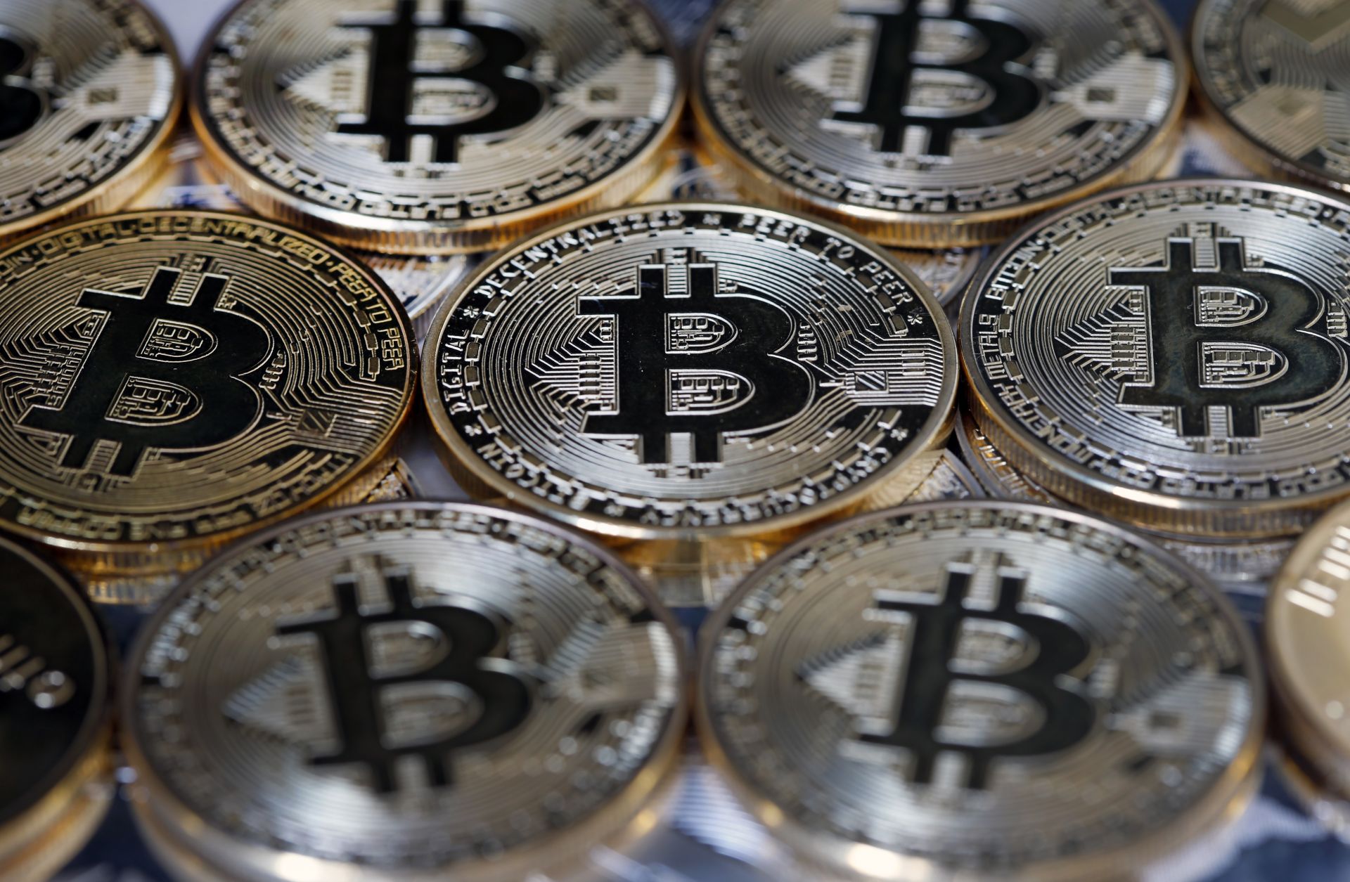 While some governments see cryptocurrencies such as bitcoin, visually represented in this photo illustration, as a threat, others want to harness the advantages they offer. A visual representation of bitcoin on display on April 3, 2019, in Paris.