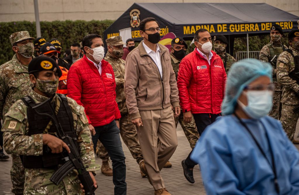 Peruvian President Martin Vizcarra (center) arrives to oversee the distribution of essential products among those in need amid the country’s COVID-19 crisis in Villa Maria del Triunfo, Peru, on Sept. 15, 2020. 