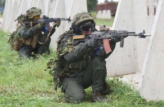 Ukrainian servicemen take part in the joint military exercises with the United States and other NATO countries near Lviv, Ukraine on Sept. 24, 2021. 