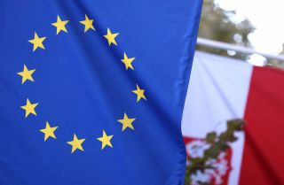 The EU and Polish flags are seen at the entrance of the Polish Permanent Representation to the European Union on Oct. 8, 2021, in Brussels, Belgium. The EU and Polish flags are seen at the entrance of the Polish Permanent Representation to the European Union on Oct. 8, 2021, in Brussels, Belgium.