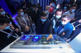 Visitors look at Alibaba's new servers at the company's annual cloud computing conference in Hangzhou, China, on Oct. 19, 2021. Visitors look at Alibaba's new servers at the company's annual cloud computing conference in Hangzhou, China, on Oct. 19, 2021.