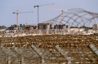 A photo taken on Oct. 28, 2021, shows ongoing construction work in an Israeli settlement near the Palestinian city of Ramallah in the West Bank. A photo taken on Oct. 28, 2021, shows ongoing construction work in an Israeli settlement near the Palestinian city of Ramallah in the West Bank.