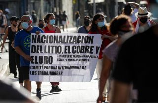 Demonstrators in Santiago take part in a protest against Chilean President Sebastian Pinera’s efforts to privatize the country’s lithium industry on Jan. 7, 2022. 