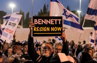 A man holds up a sign during an anti-government protest staged by Israeli right-wing supporters in Jerusalem, Israel, on April 6, 2022. A man holds up a sign during an anti-government protest staged by Israeli right-wing supporters in Jerusalem, Israel, on April 6, 2022.