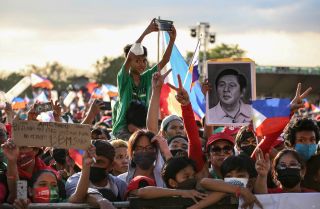 Supporters of Philippine presidential candidate Ferdinand Marcos Jr., son of the country's late dictator, attend a campaign rally in a Manila suburb on April 24, 2022.